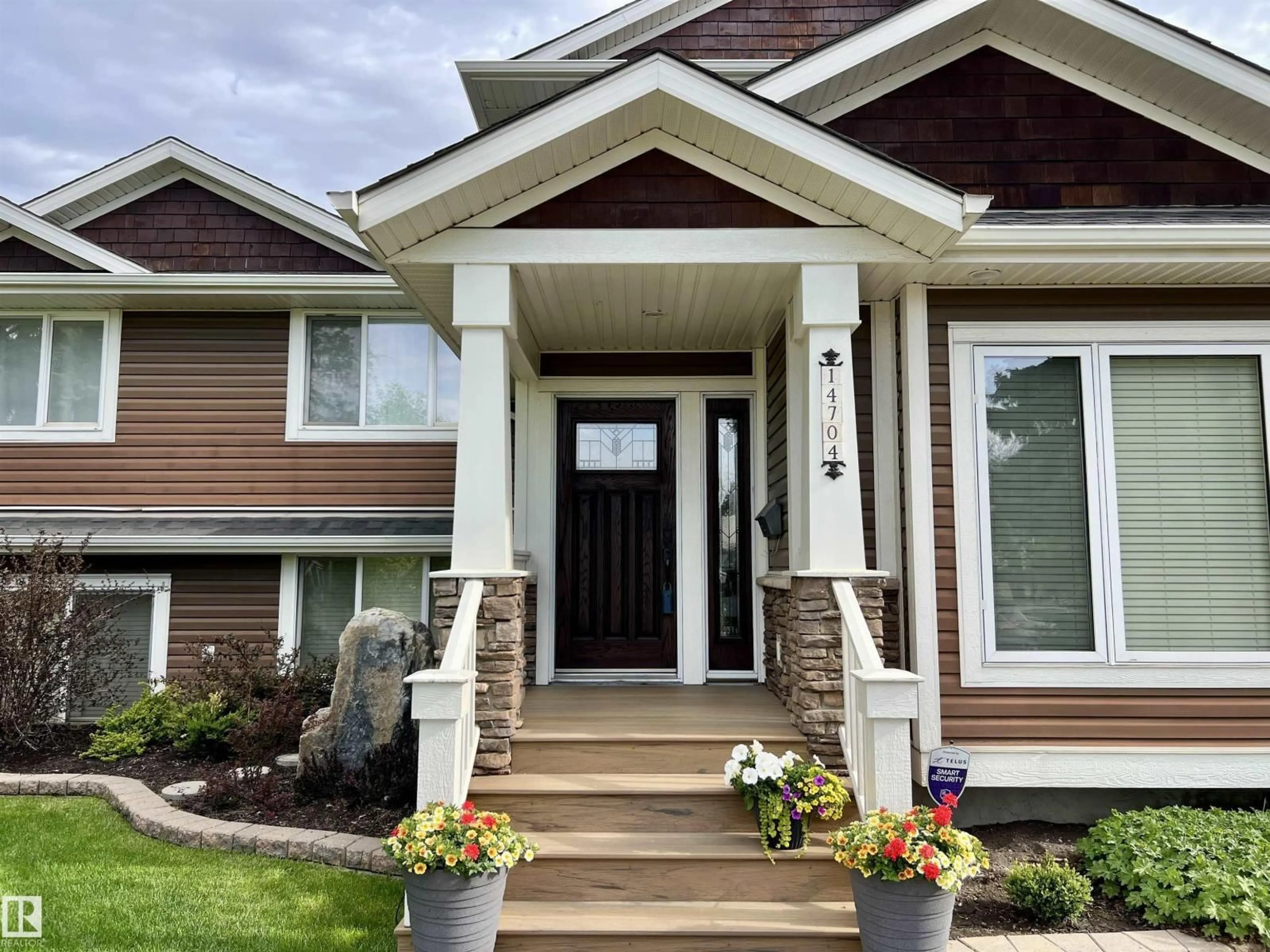 Home with vinyl exterior material, street for 14704 88 AV, Edmonton Alberta T5R4J8