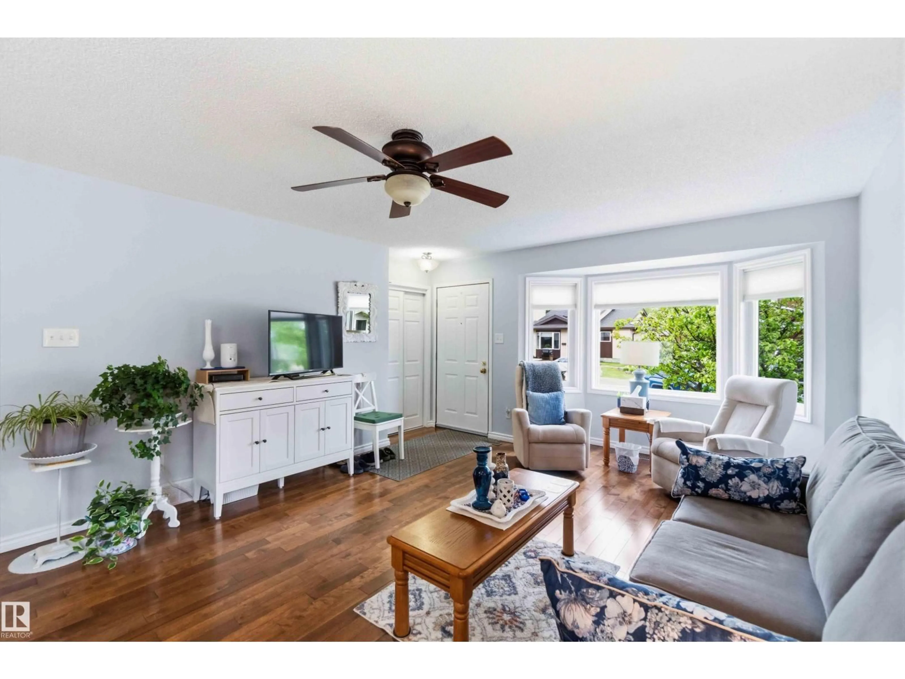Living room with furniture, wood/laminate floor for 96 MCKEAN WY, Spruce Grove Alberta T7X2S7