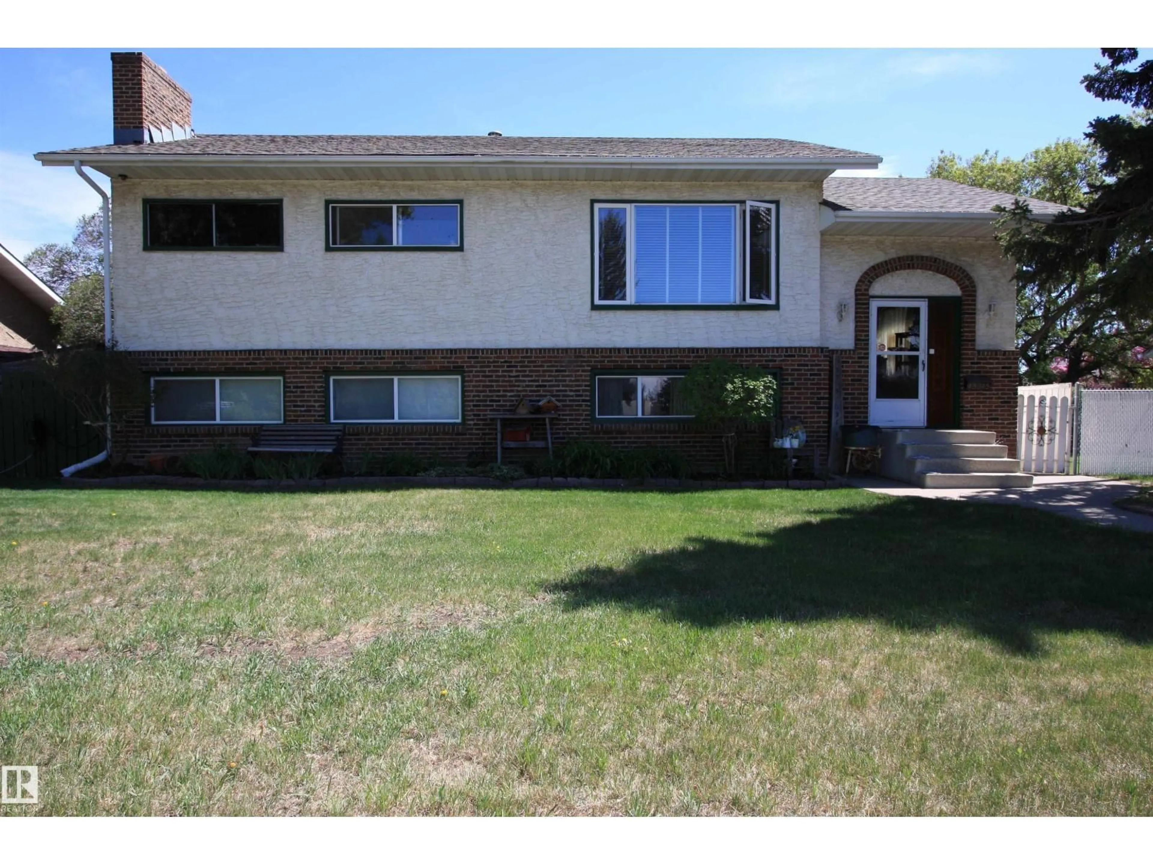 Home with vinyl exterior material, street for NW - 13315 136 ST, Edmonton Alberta T5L1Z8