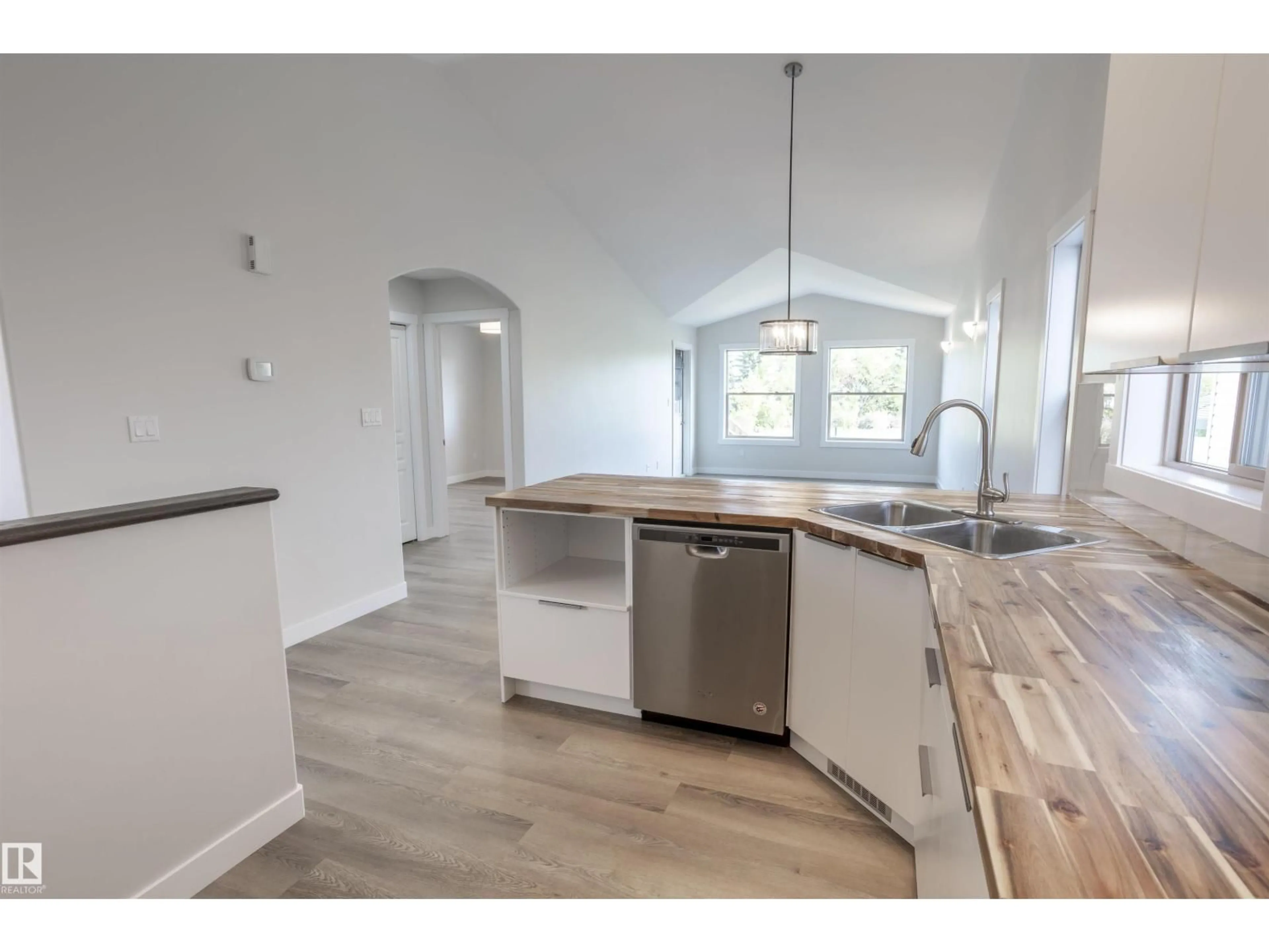 Open concept kitchen, wood/laminate floor for 738 KANANASKIS DR, Devon Alberta T9G2G7
