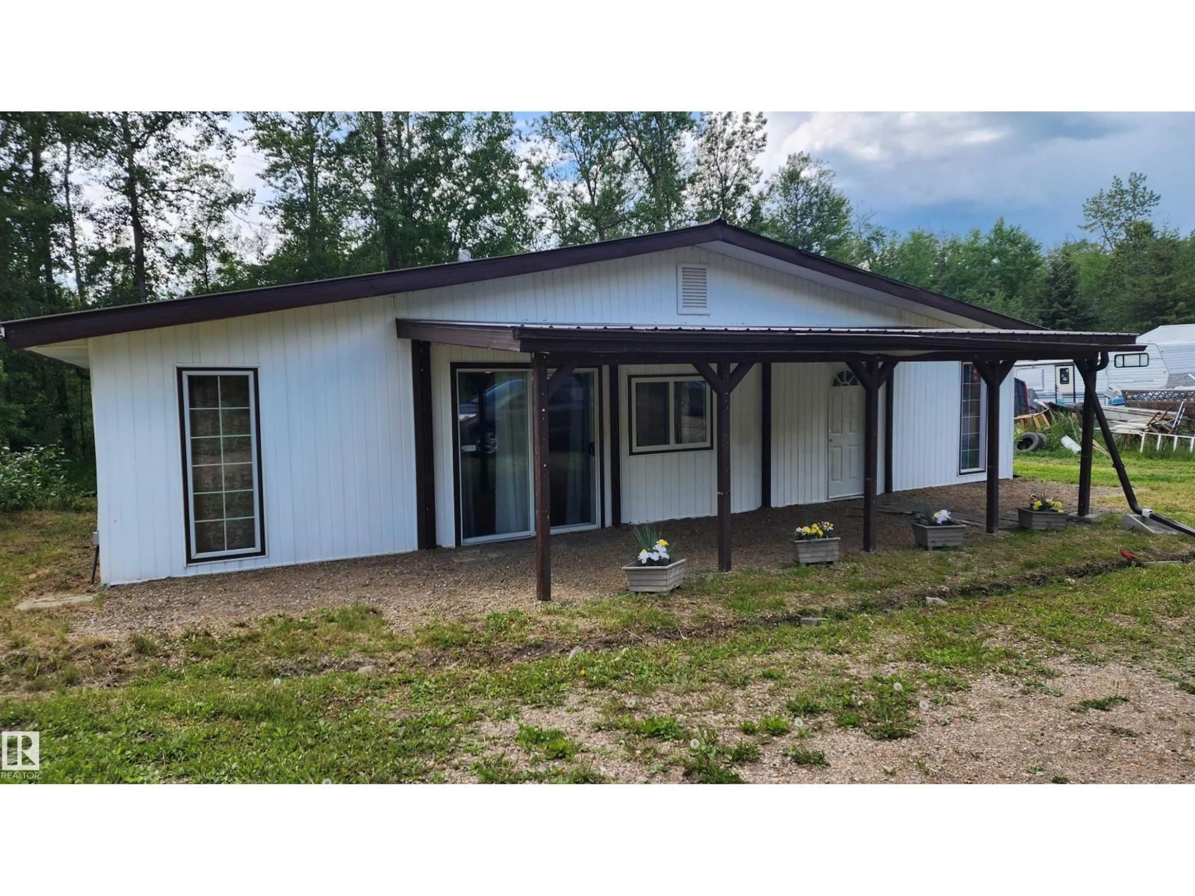 Home with vinyl exterior material, mountain view for 63303 - 174 HWY 867 HWY, Rural Lac La Biche County Alberta T0A2C0