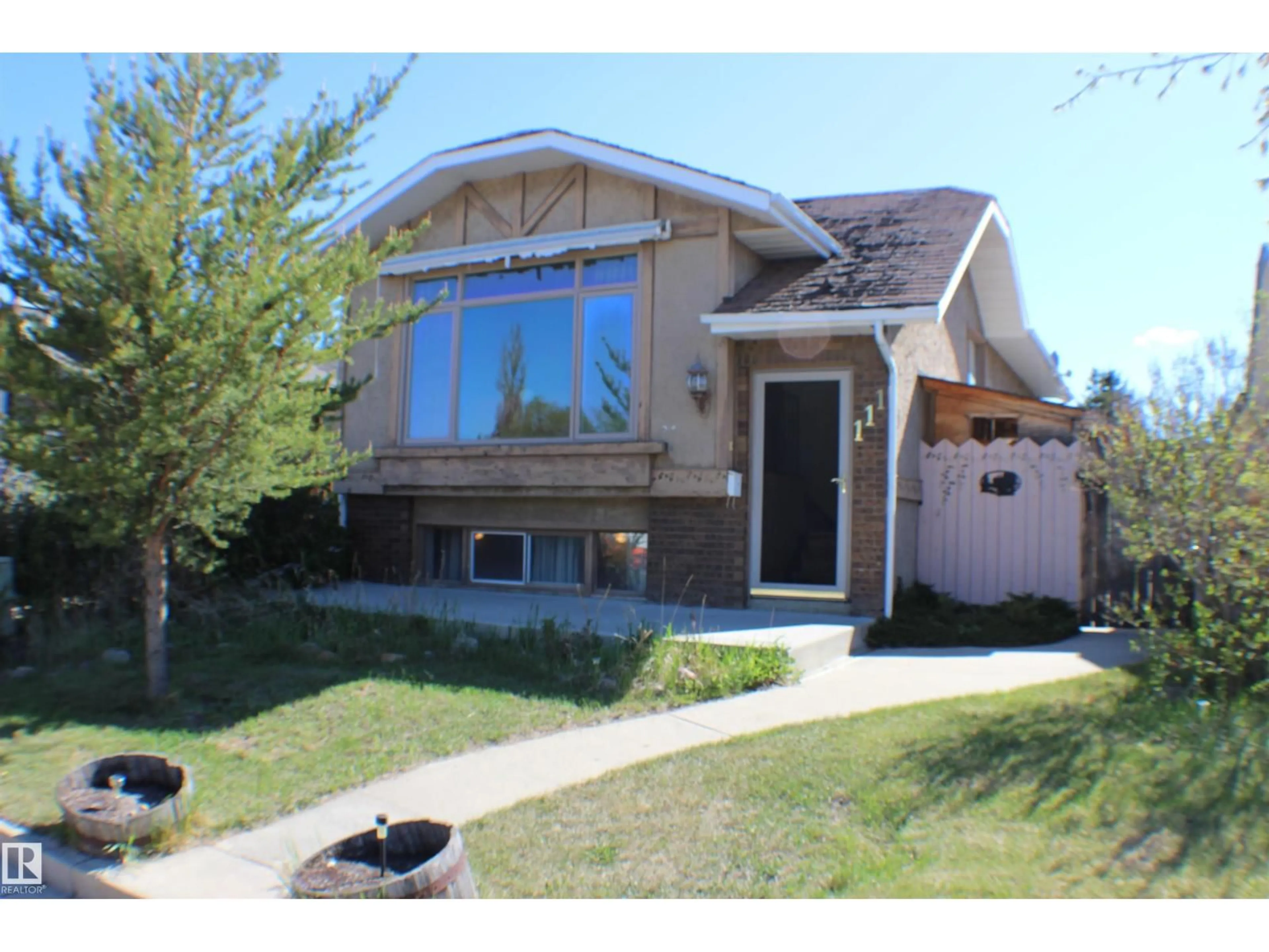 Home with vinyl exterior material, street for 111 DIAMOND DR, Millet Alberta T0C1Z0