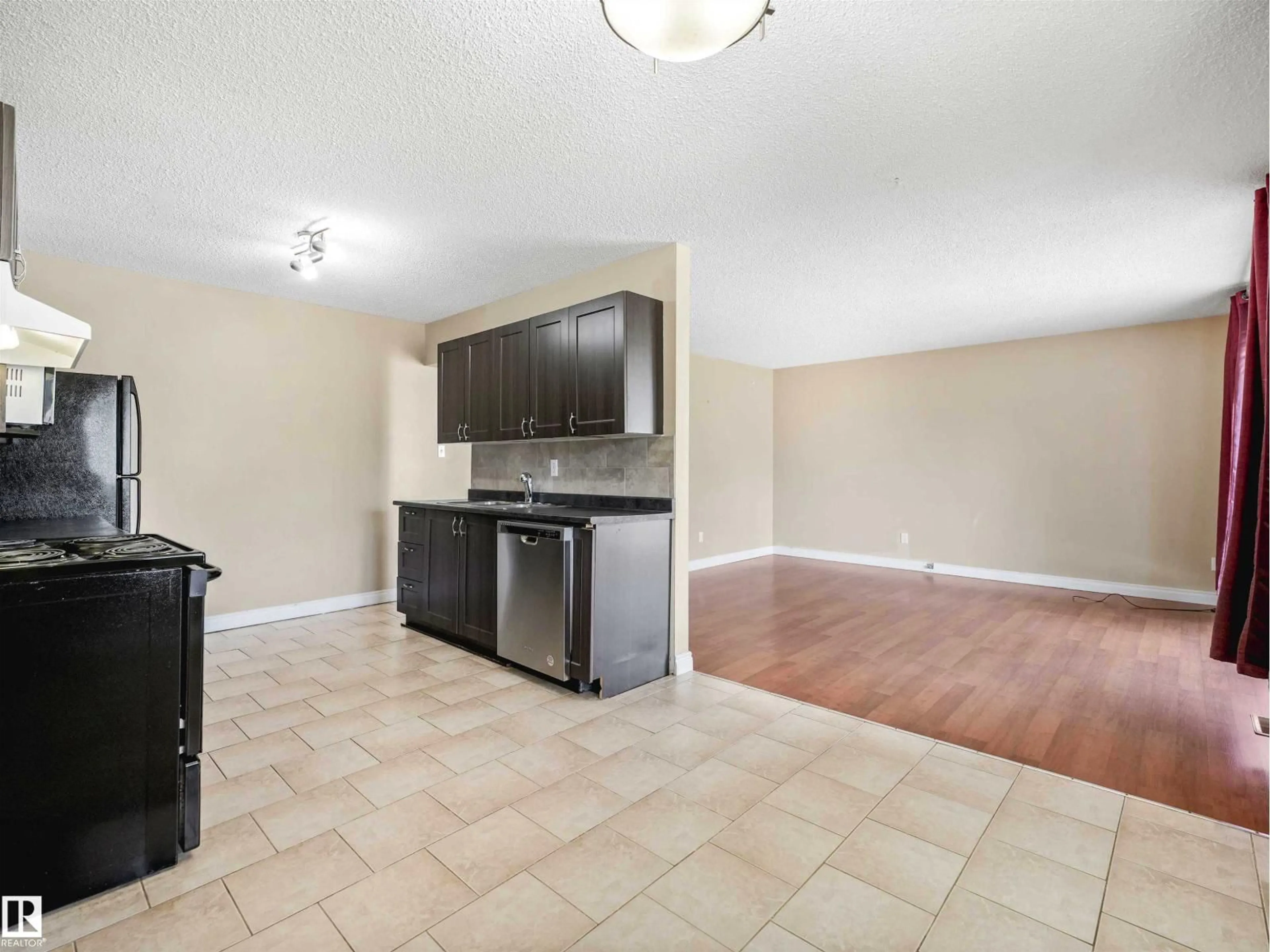 Open concept kitchen, ceramic/tile floor for NW - 13114 30 ST, Edmonton Alberta T5A3A2