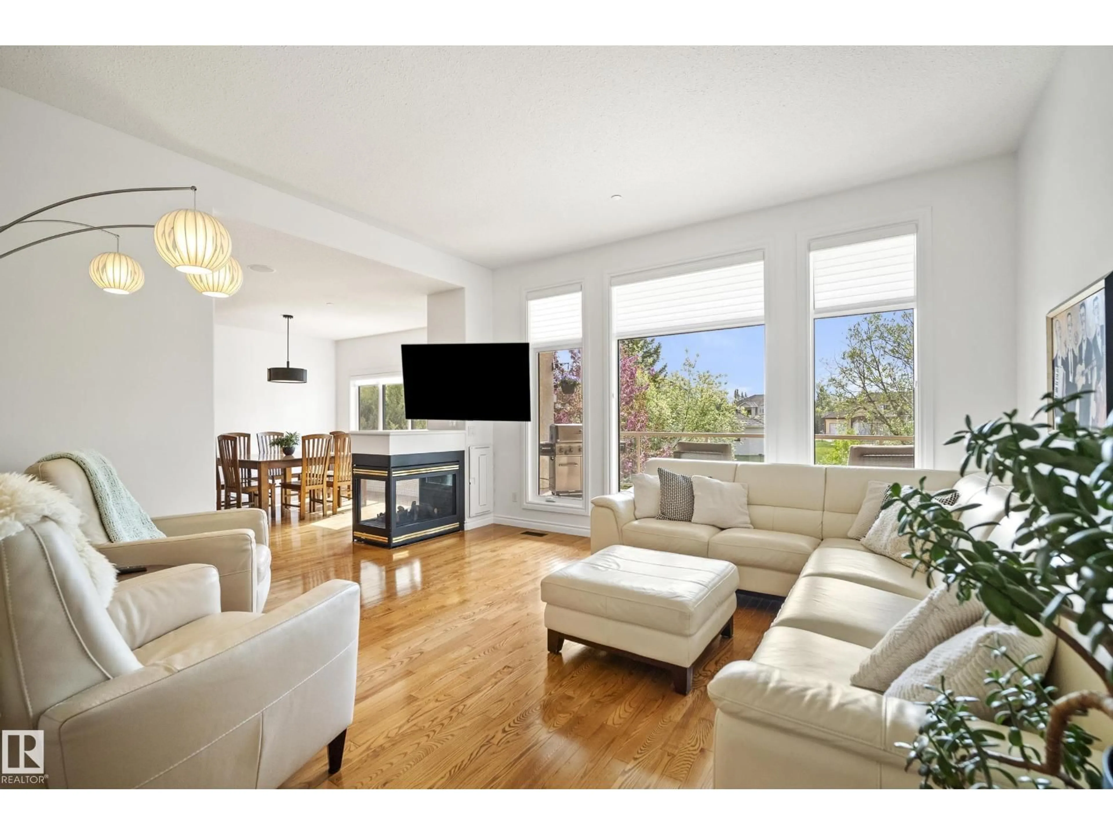 Living room with furniture, wood/laminate floor for 52304 - 139 RGE ROAD 233 RD, Rural Strathcona County Alberta T8B1C9