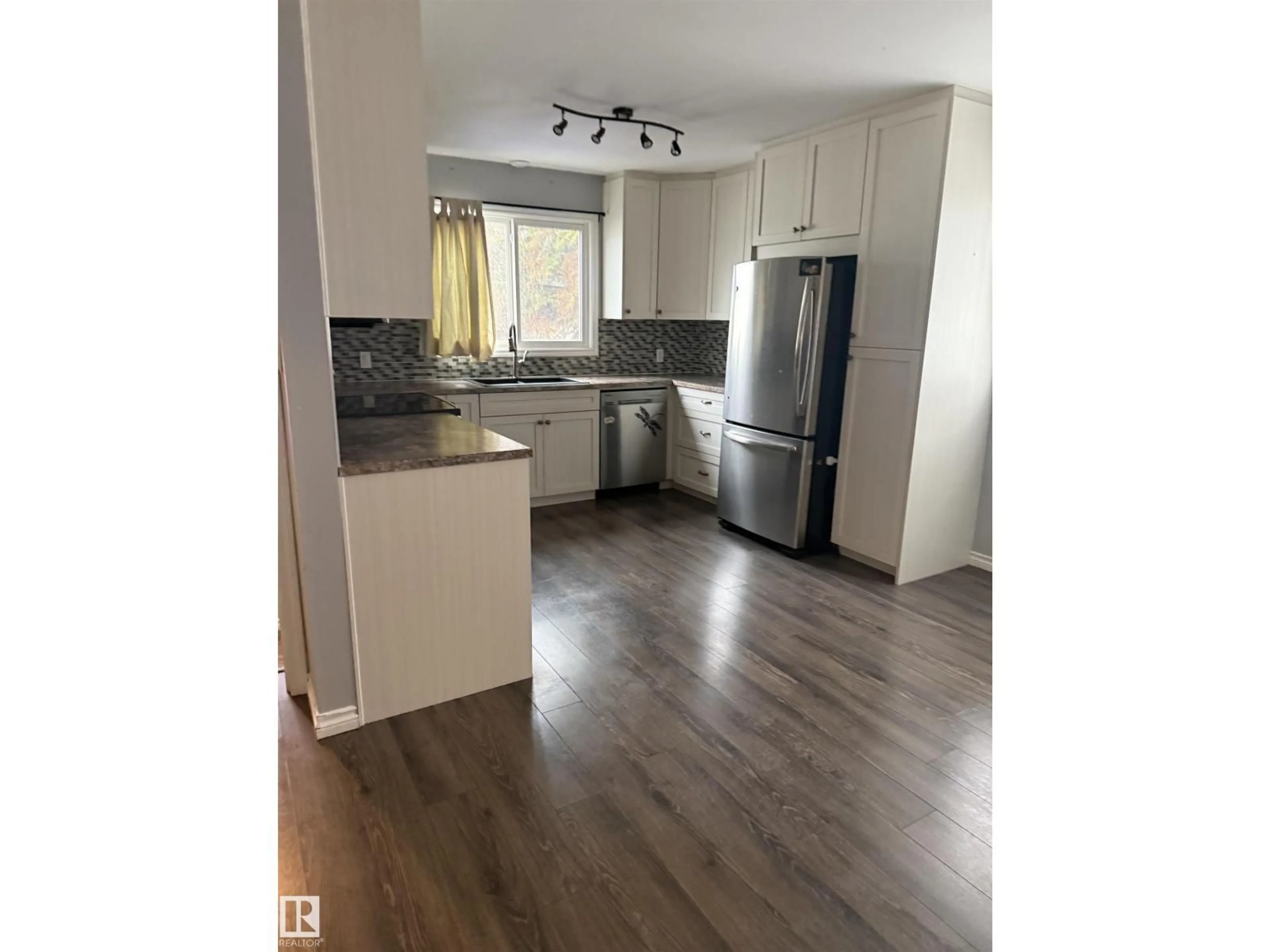 Open concept kitchen, wood/laminate floor for 5307 48 ST, Stony Plain Alberta T7Z1E4
