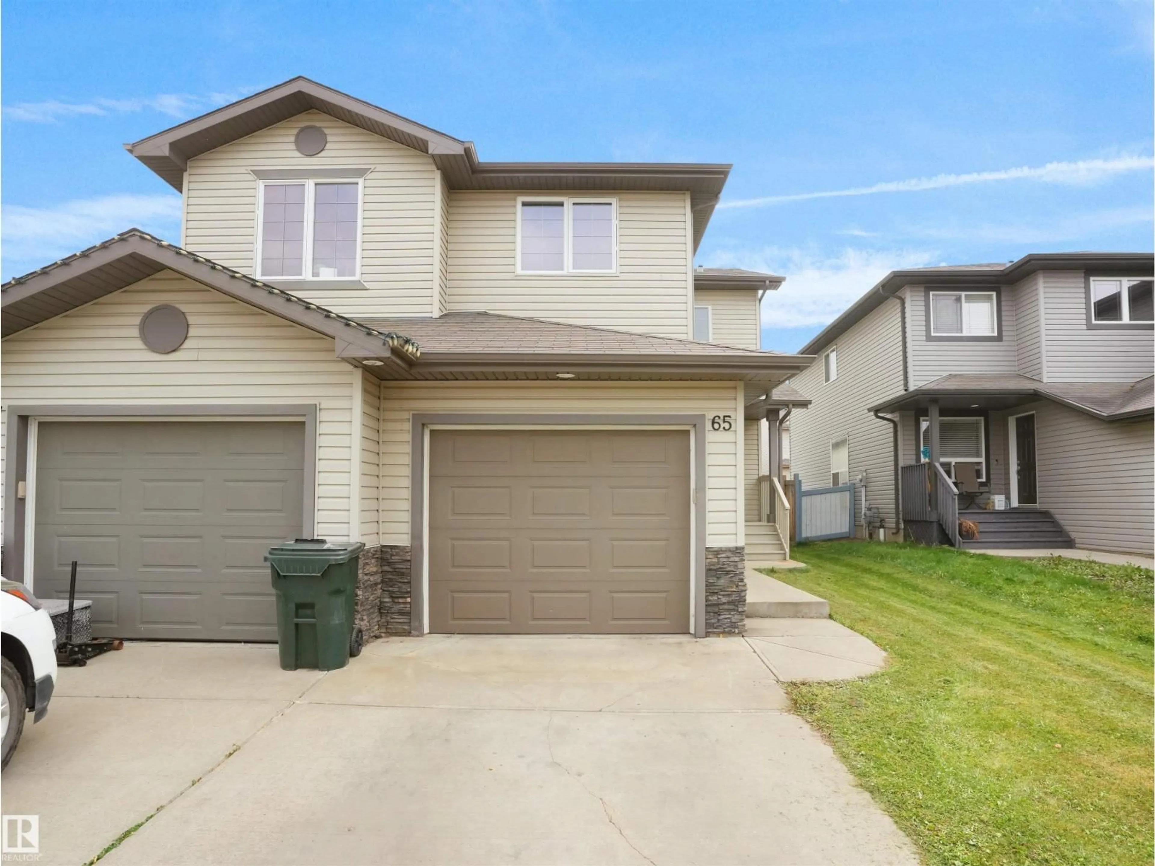 Home with vinyl exterior material, street for 65 ASHBY GD, Spruce Grove Alberta T7X0K1