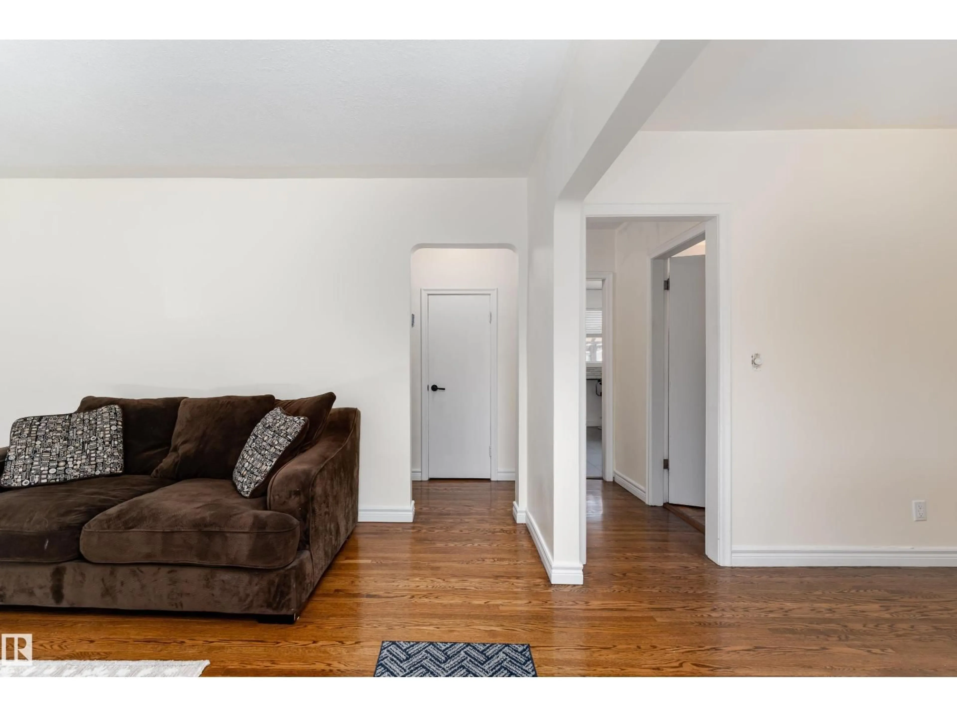Living room with furniture, wood/laminate floor for NW - 13028 123A AV, Edmonton Alberta T5L2Y9
