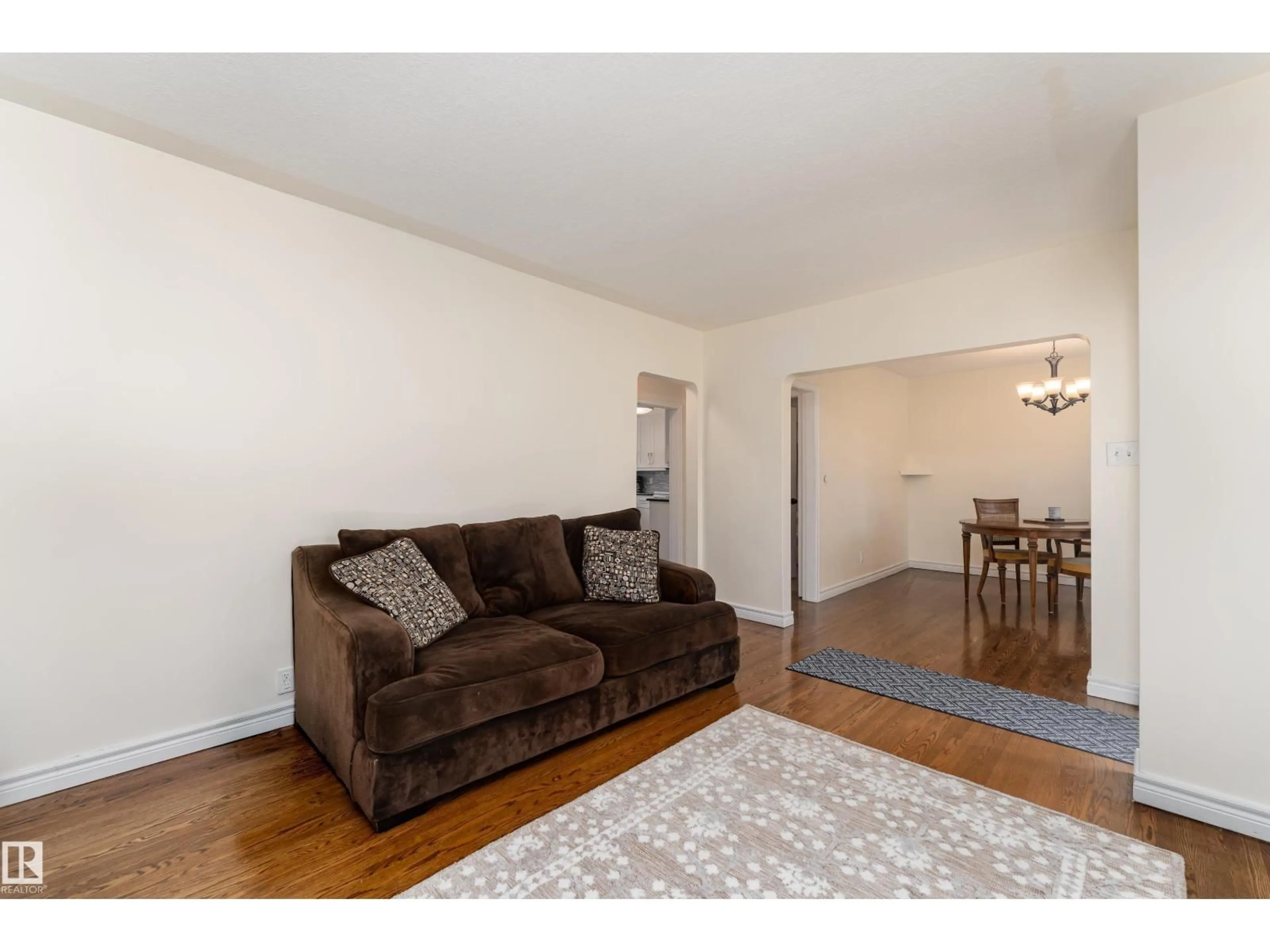 Living room with furniture, wood/laminate floor for NW - 13028 123A AV, Edmonton Alberta T5L2Y9
