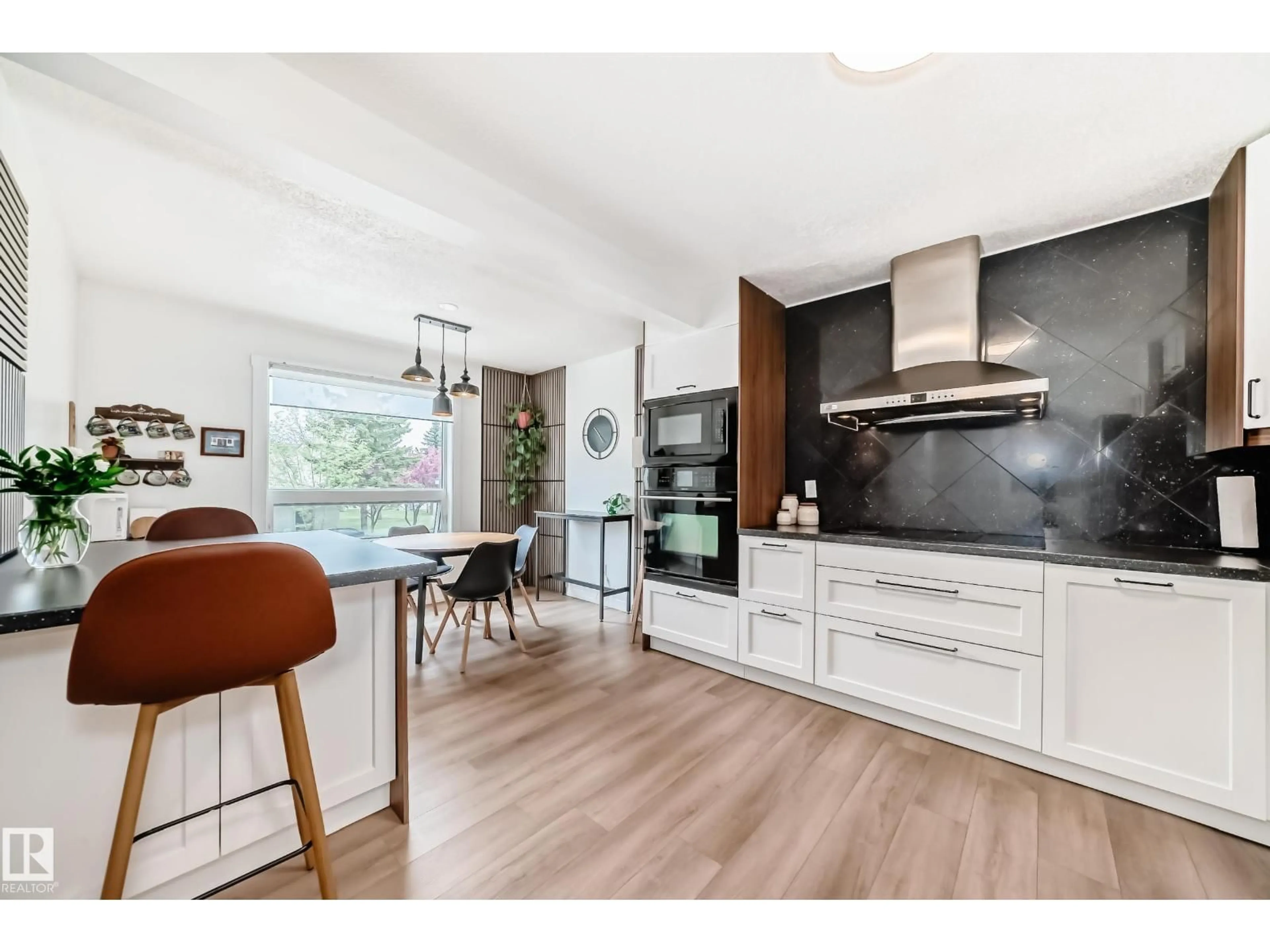 Open concept kitchen, wood/laminate floor for 9520 - 18 174 ST, Edmonton Alberta T5T5Z3