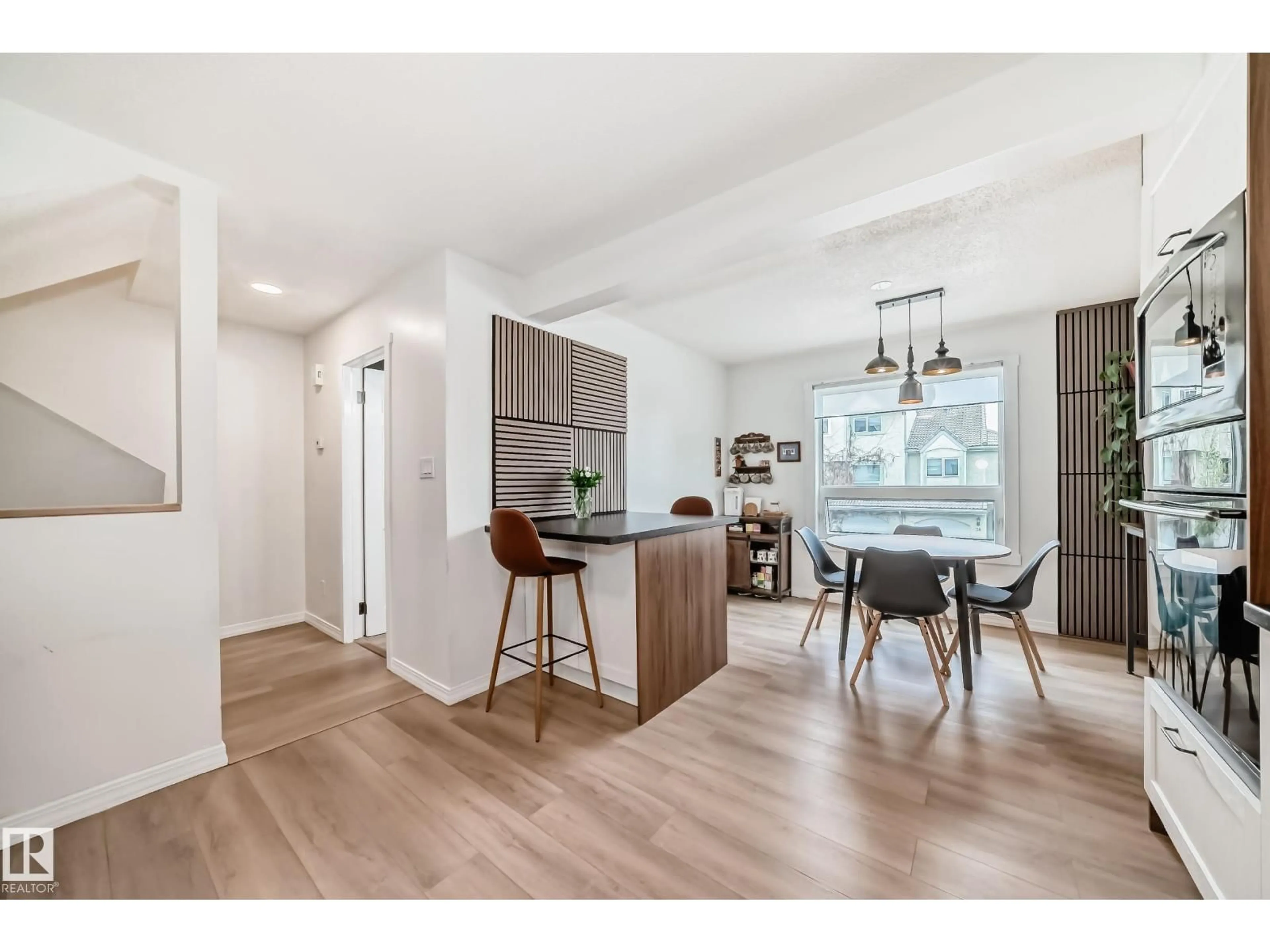 Open concept kitchen, wood/laminate floor for 9520 - 18 174 ST, Edmonton Alberta T5T5Z3