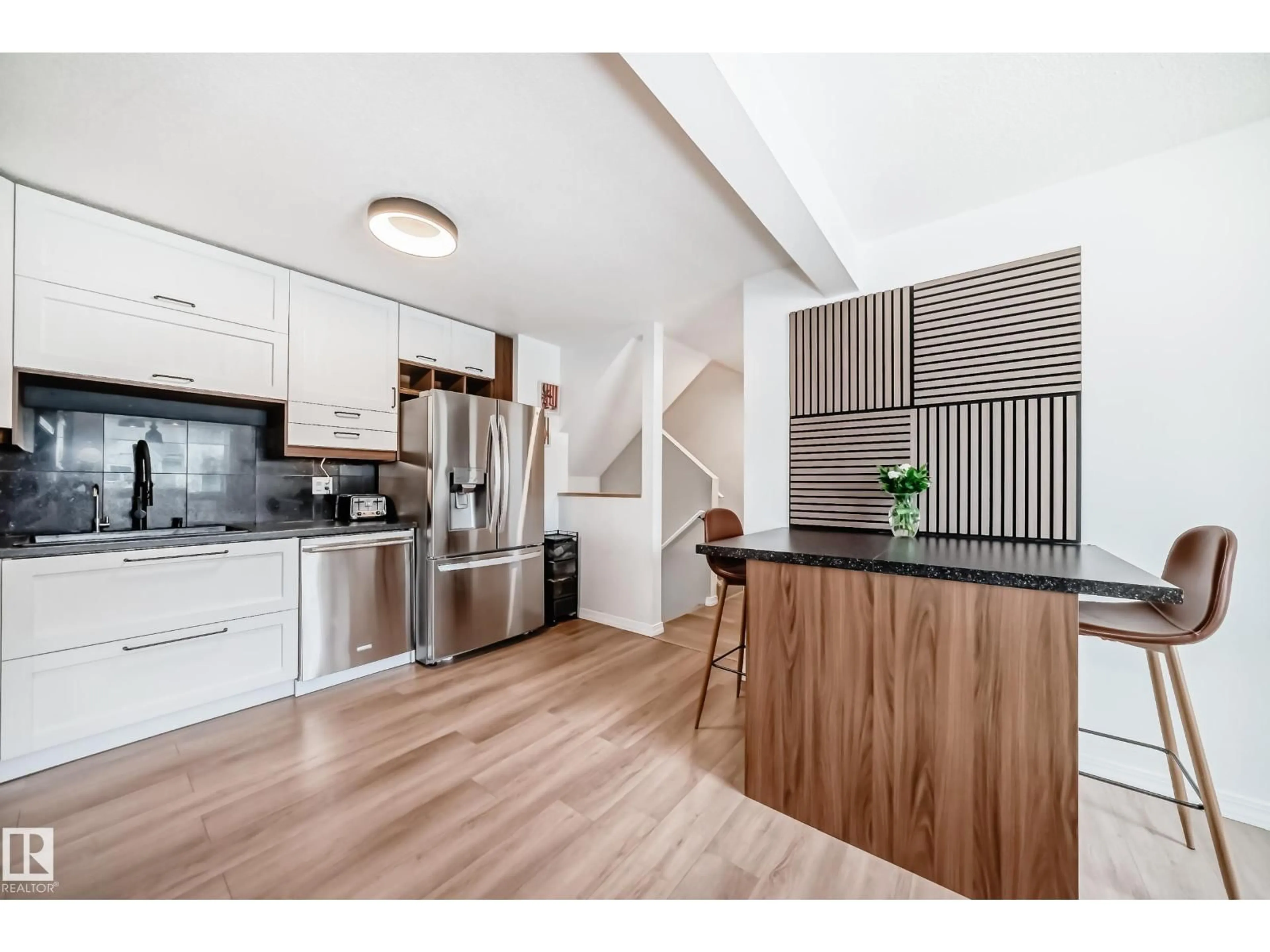 Open concept kitchen, wood/laminate floor for 9520 - 18 174 ST, Edmonton Alberta T5T5Z3