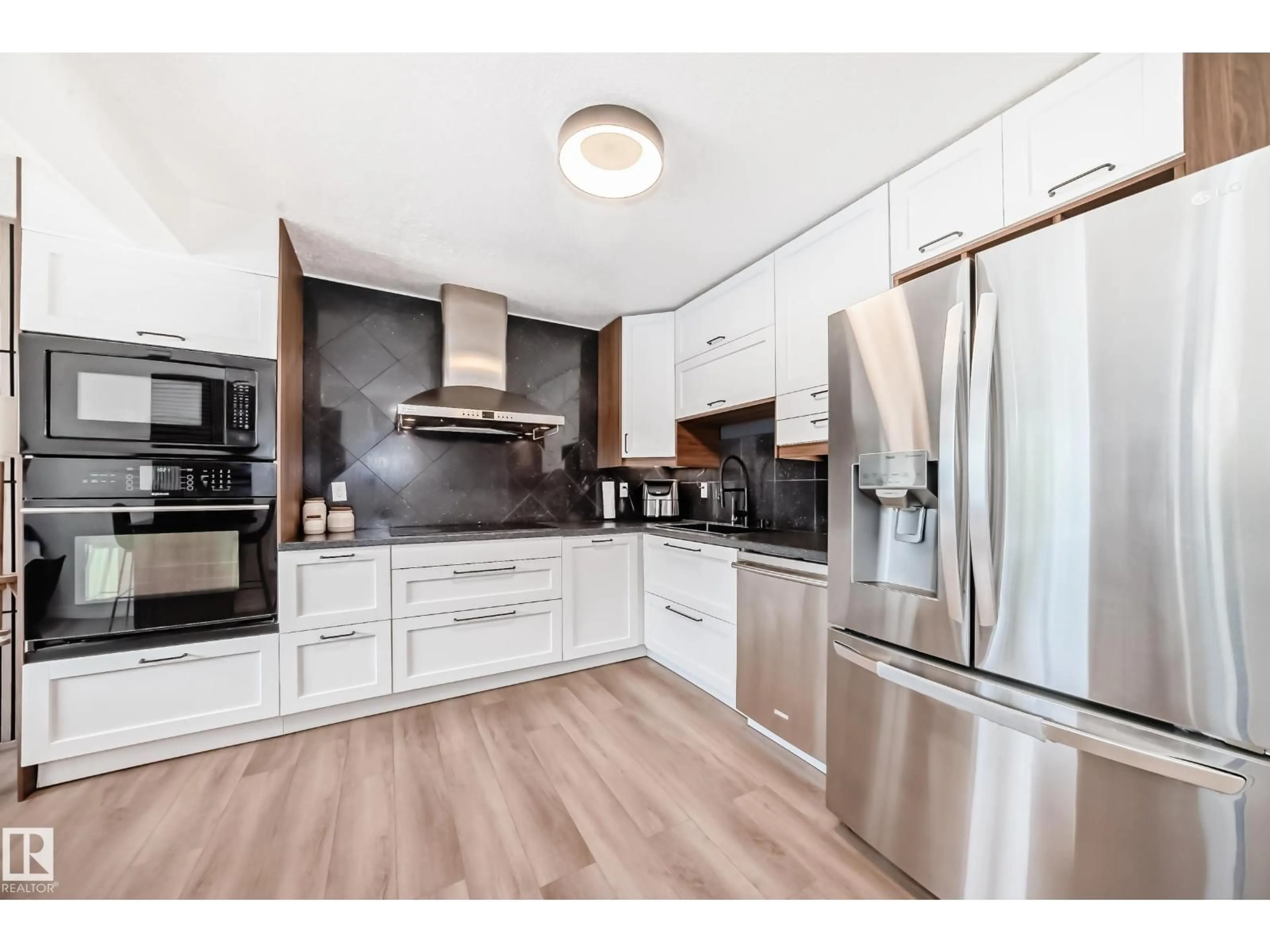 Open concept kitchen, wood/laminate floor for 9520 - 18 174 ST, Edmonton Alberta T5T5Z3