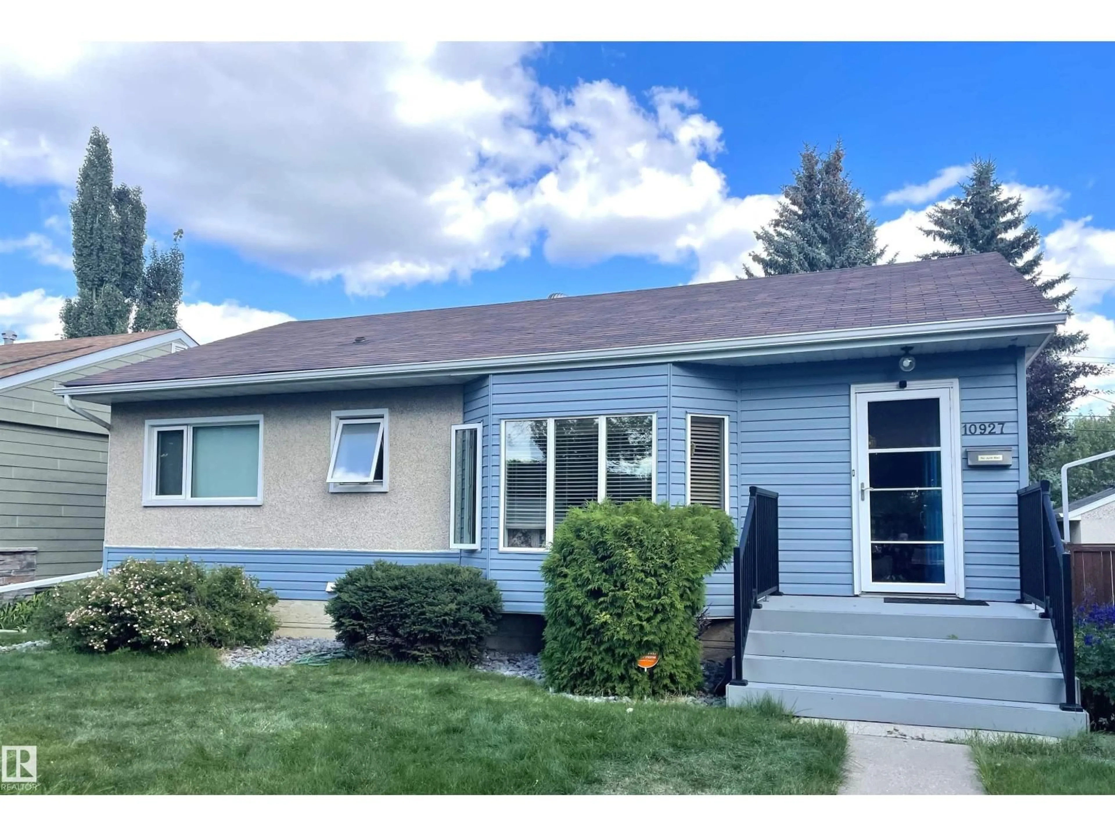 Home with vinyl exterior material, street for NW - 10927 146 ST, Edmonton Alberta T5N3A8
