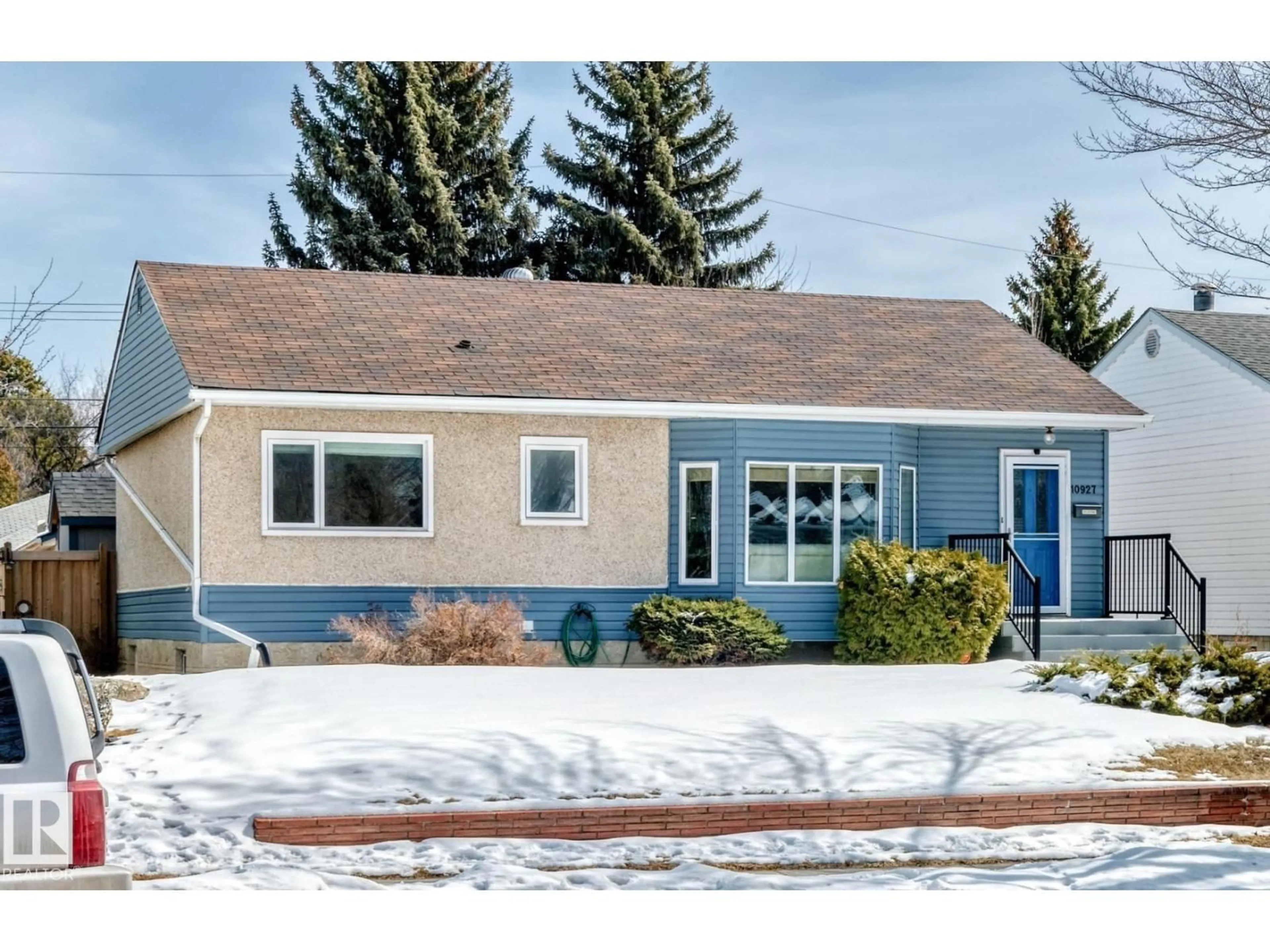 Home with vinyl exterior material, street for NW - 10927 146 ST, Edmonton Alberta T5N3A8