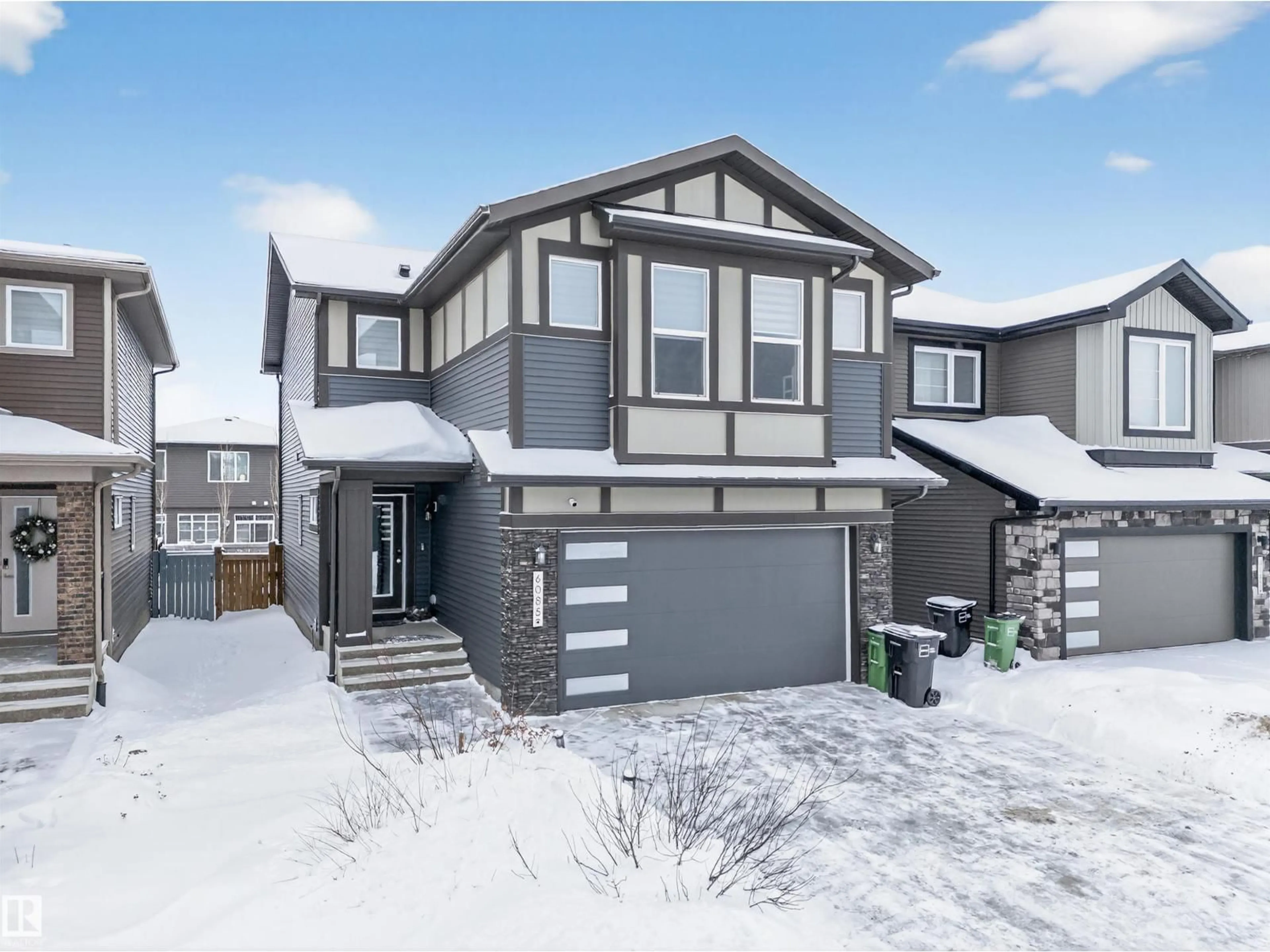 Home with vinyl exterior material, street for 6085 KING LD, Edmonton Alberta T6W3Z7