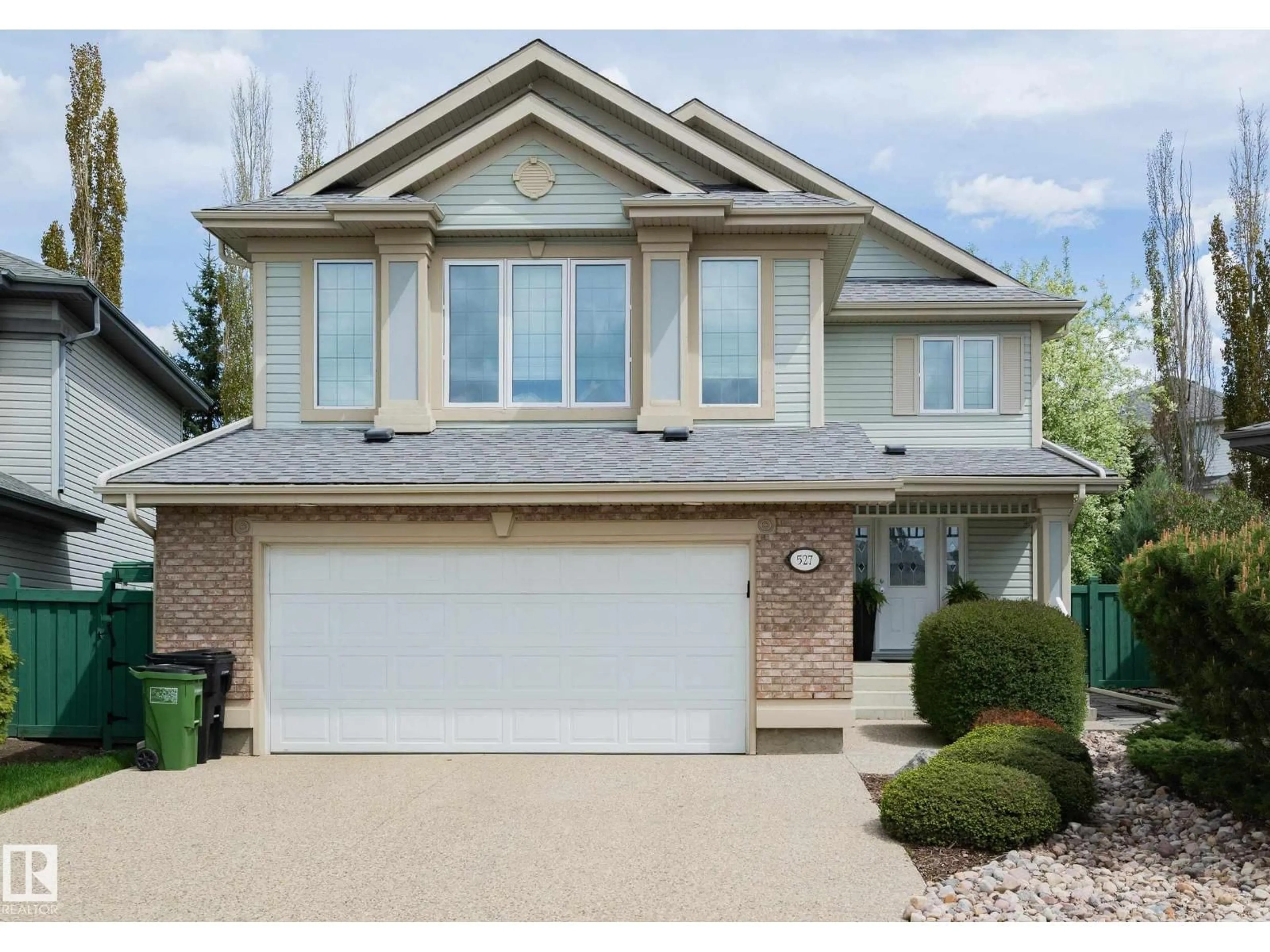 Home with vinyl exterior material, street for NW - 527 HUNTERS GREEN GR, Edmonton Alberta T6R3B6
