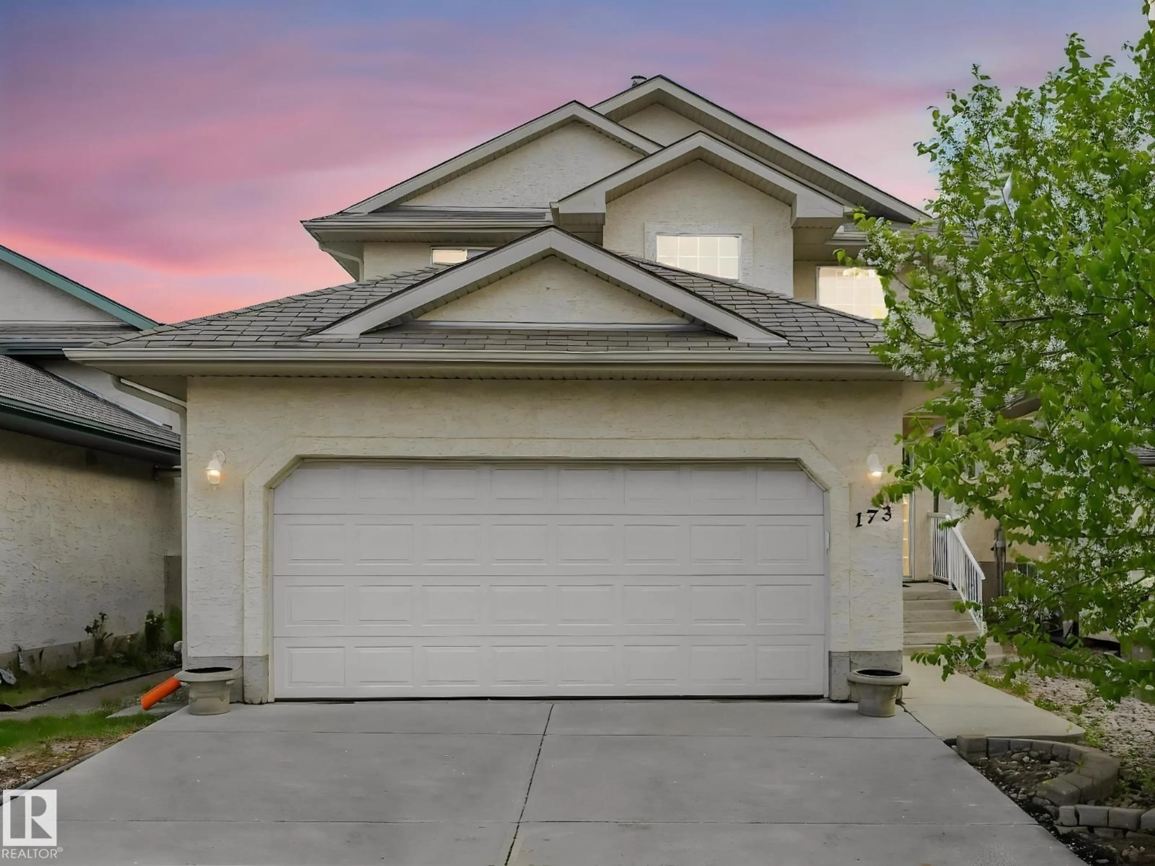 Home with vinyl exterior material, street for 173 CASTLE DR, Edmonton Alberta T5X6G4