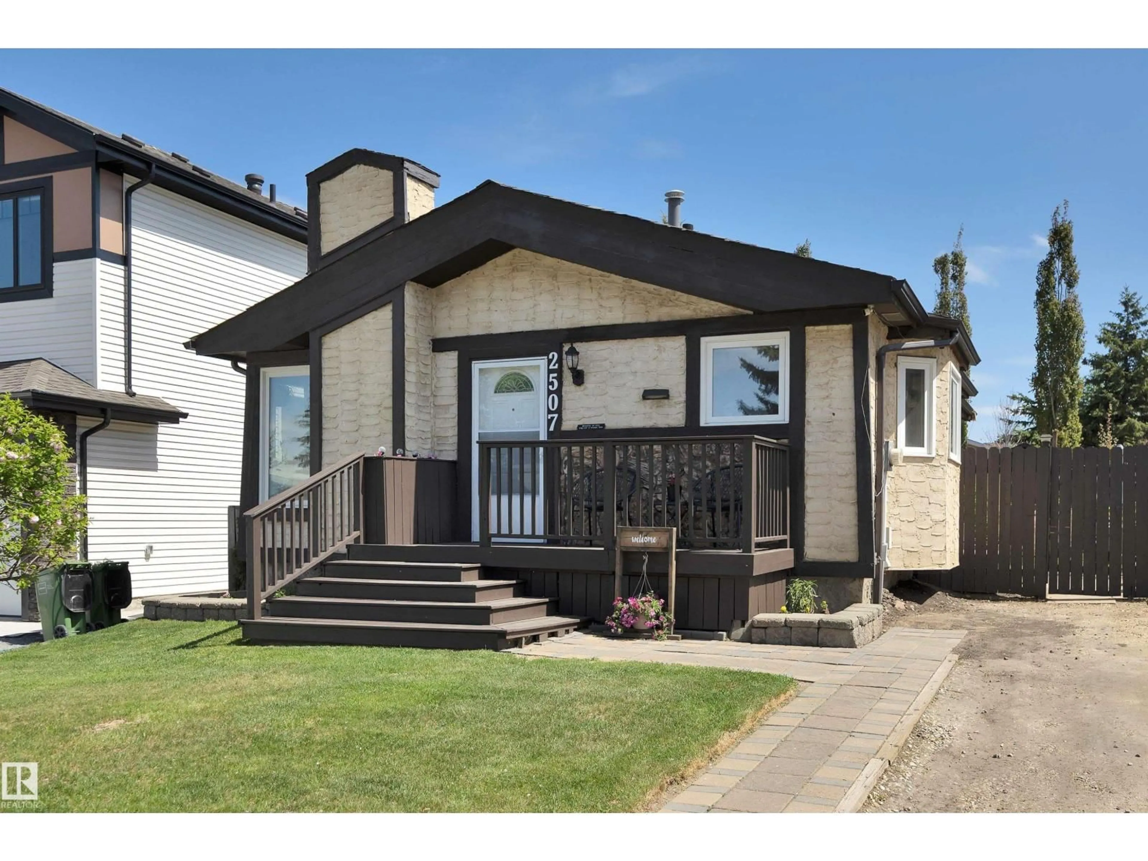 Home with vinyl exterior material, street for NW - 2507 49A ST, Edmonton Alberta T6L3X2