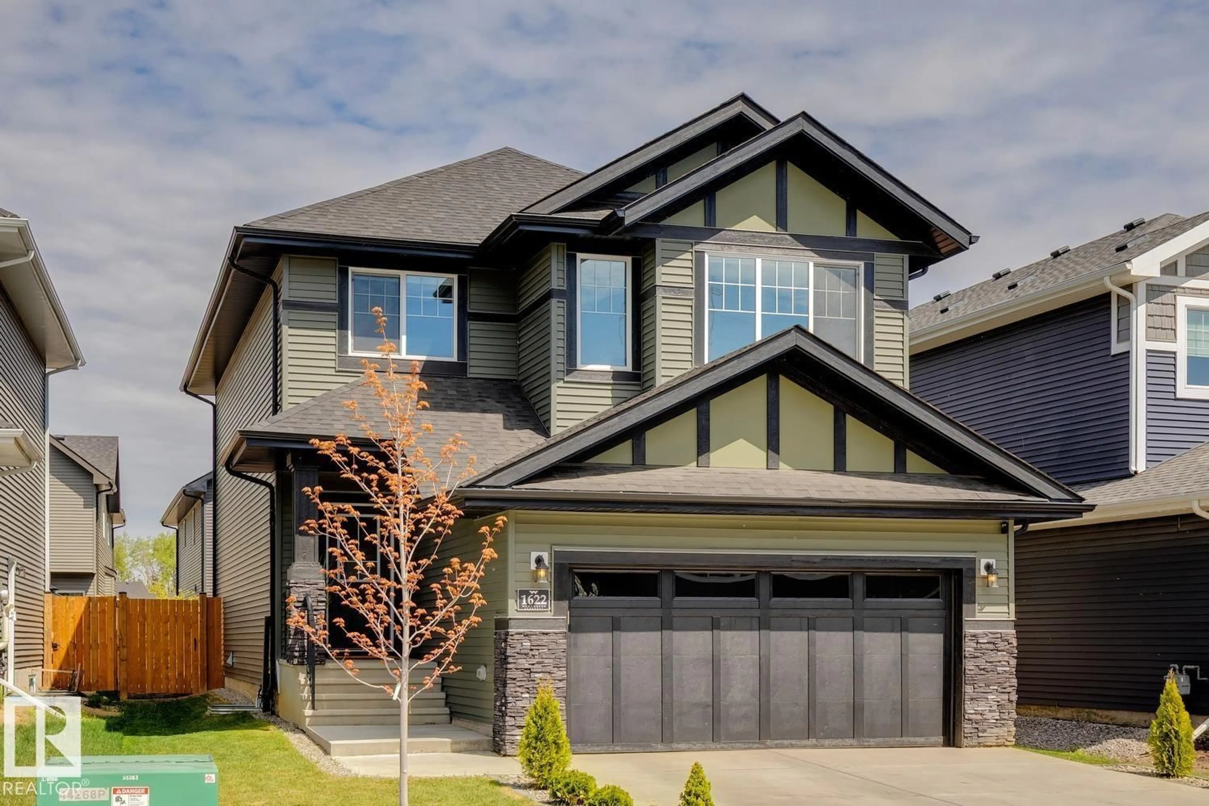 Home with vinyl exterior material, street for 1622 ENRIGHT WY, Edmonton Alberta T6M0Z3