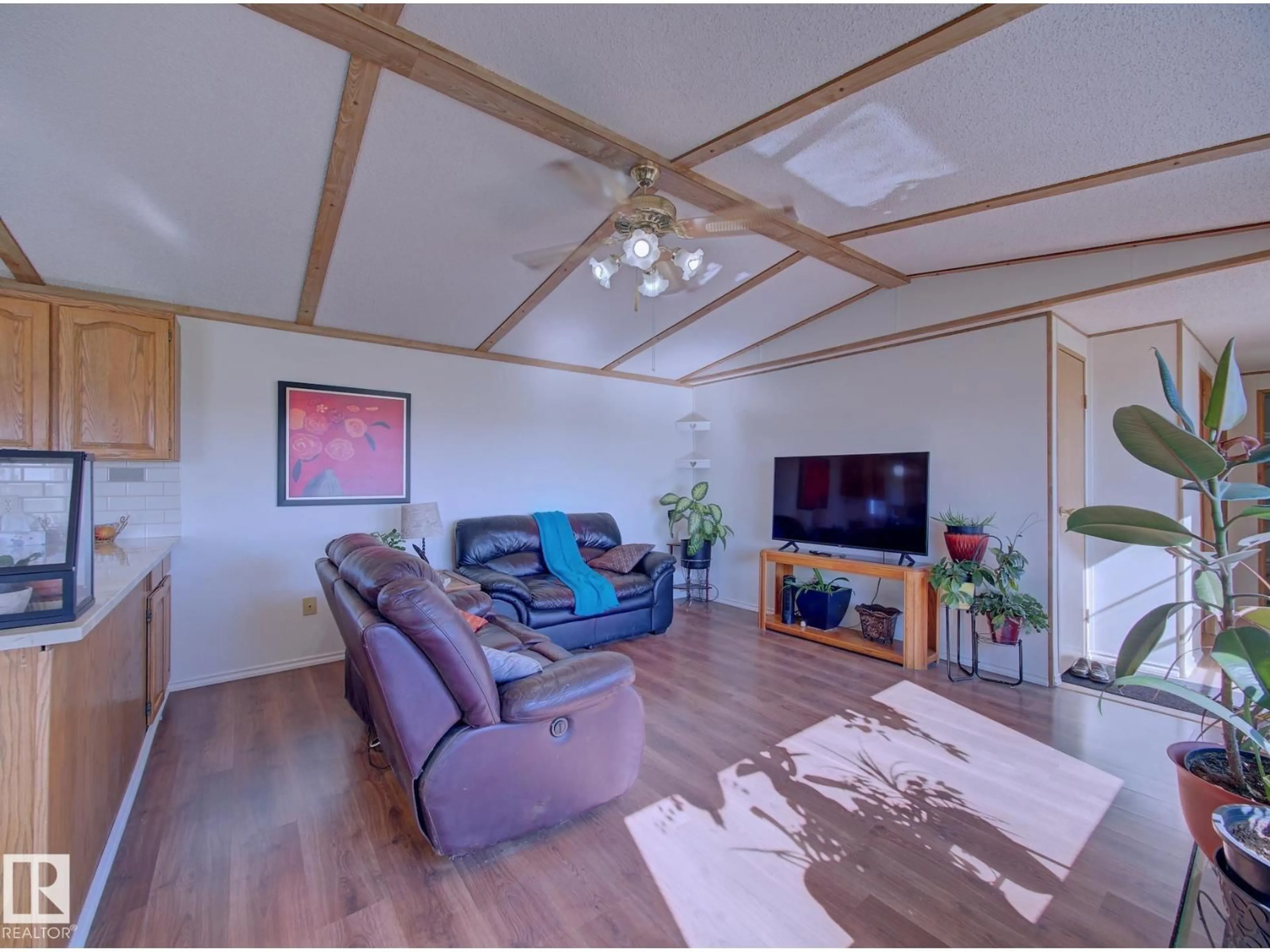Living room with furniture, wood/laminate floor for 534034 RR 182, Rural Lamont County Alberta T0B0W0