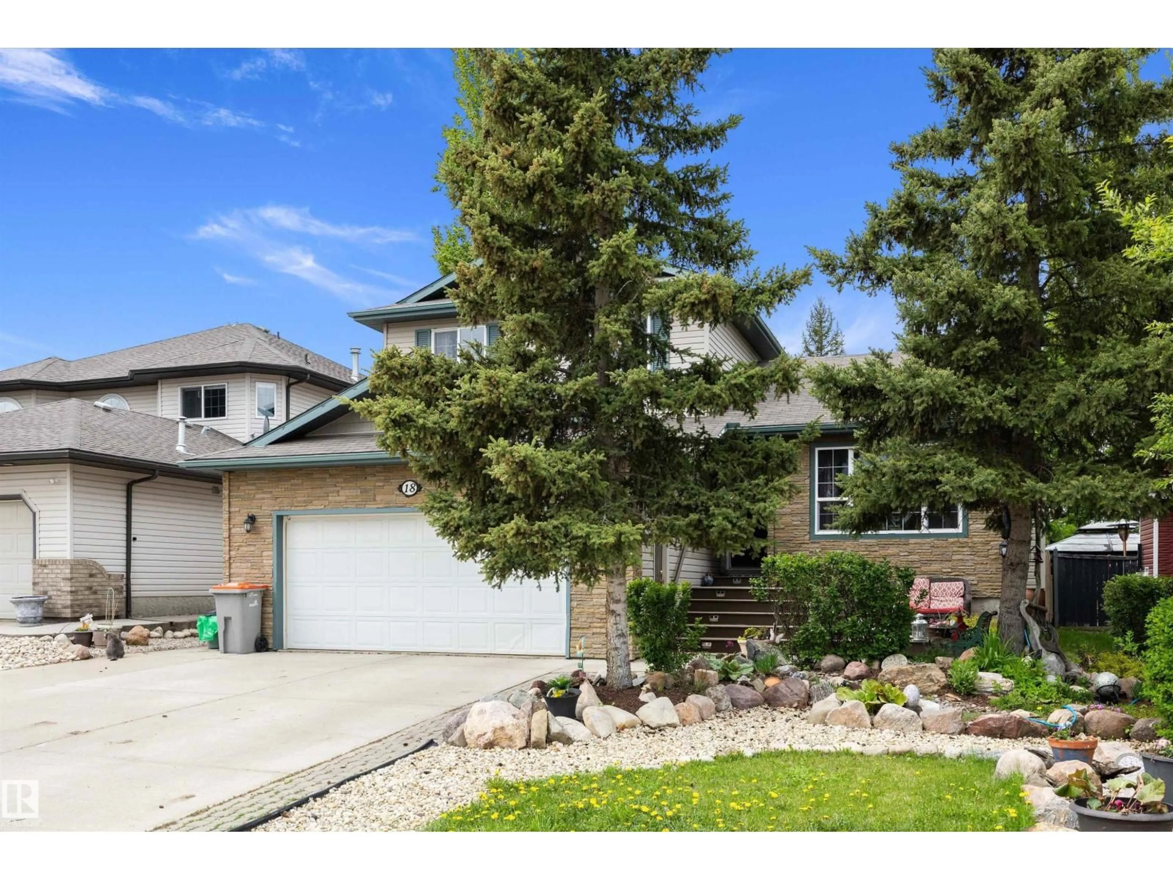 Home with vinyl exterior material, street for 18 HARMONY CR, Stony Plain Alberta T7Z2M9