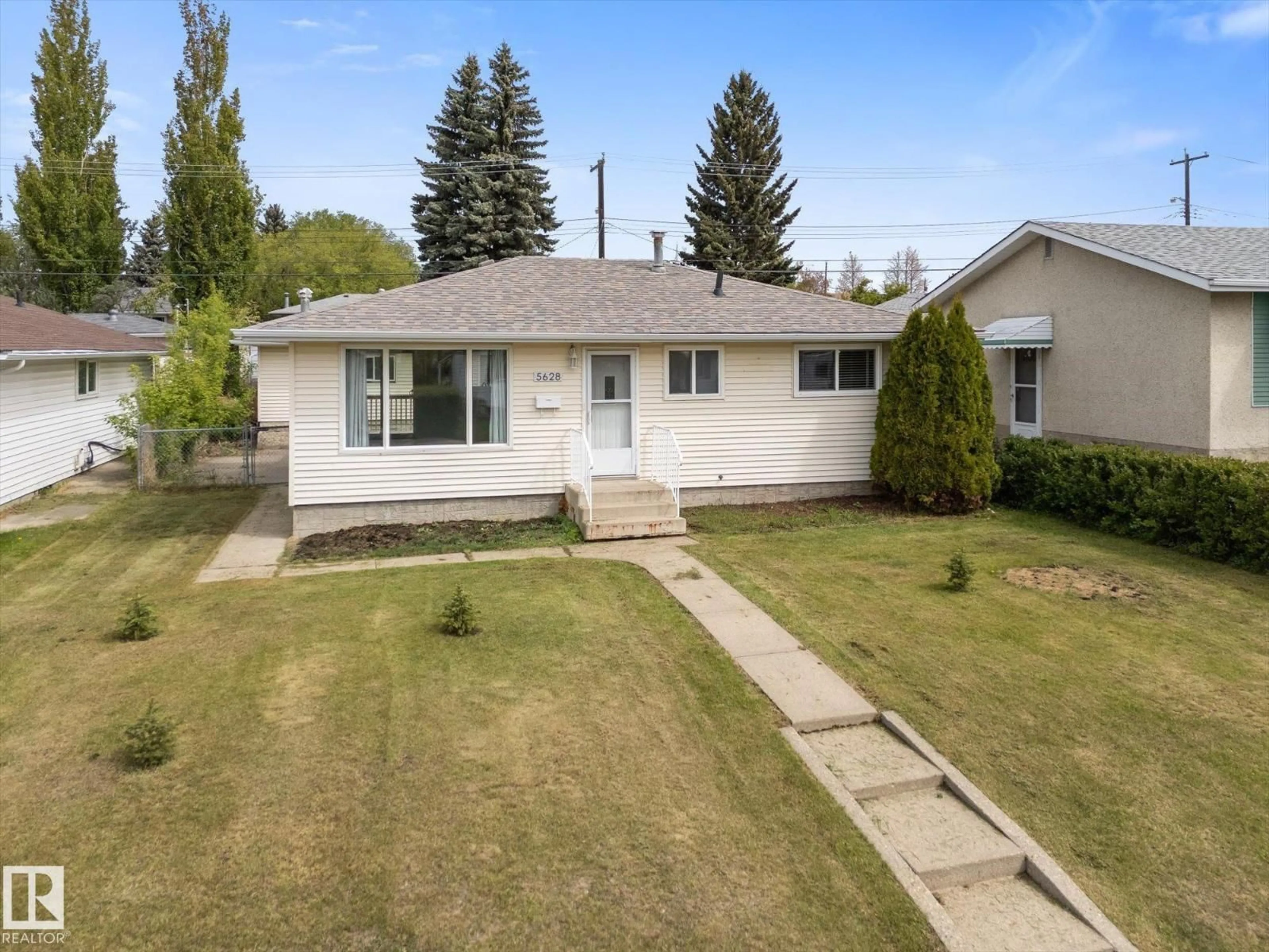 A pic from outside/outdoor area/front of a property/back of a property/a pic from drone, street for 5628 140A AV, Edmonton Alberta T5A1H3
