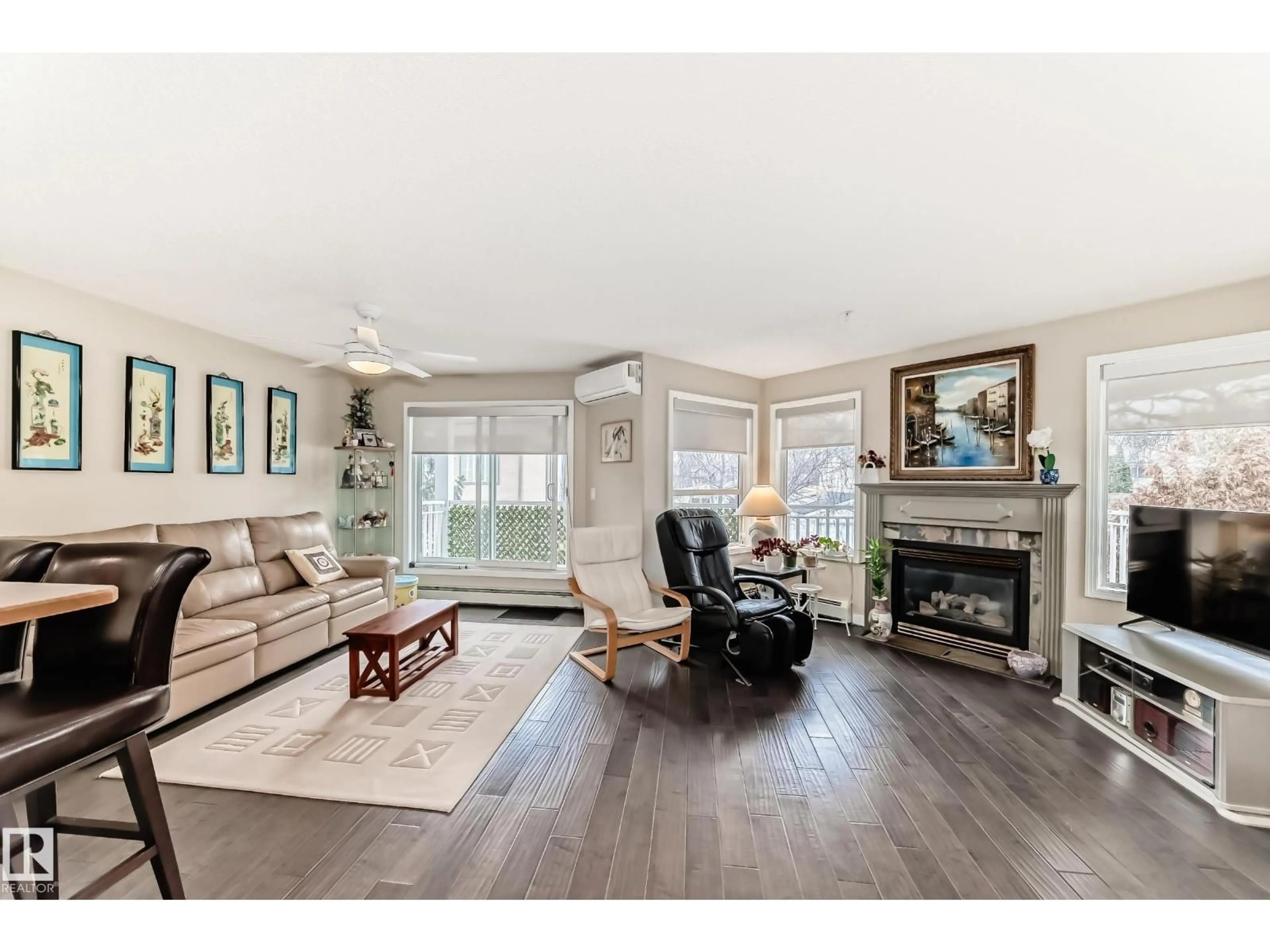 Living room with furniture, wood/laminate floor for 215 - 10951 124 ST NW, Edmonton Alberta T5Z3H1