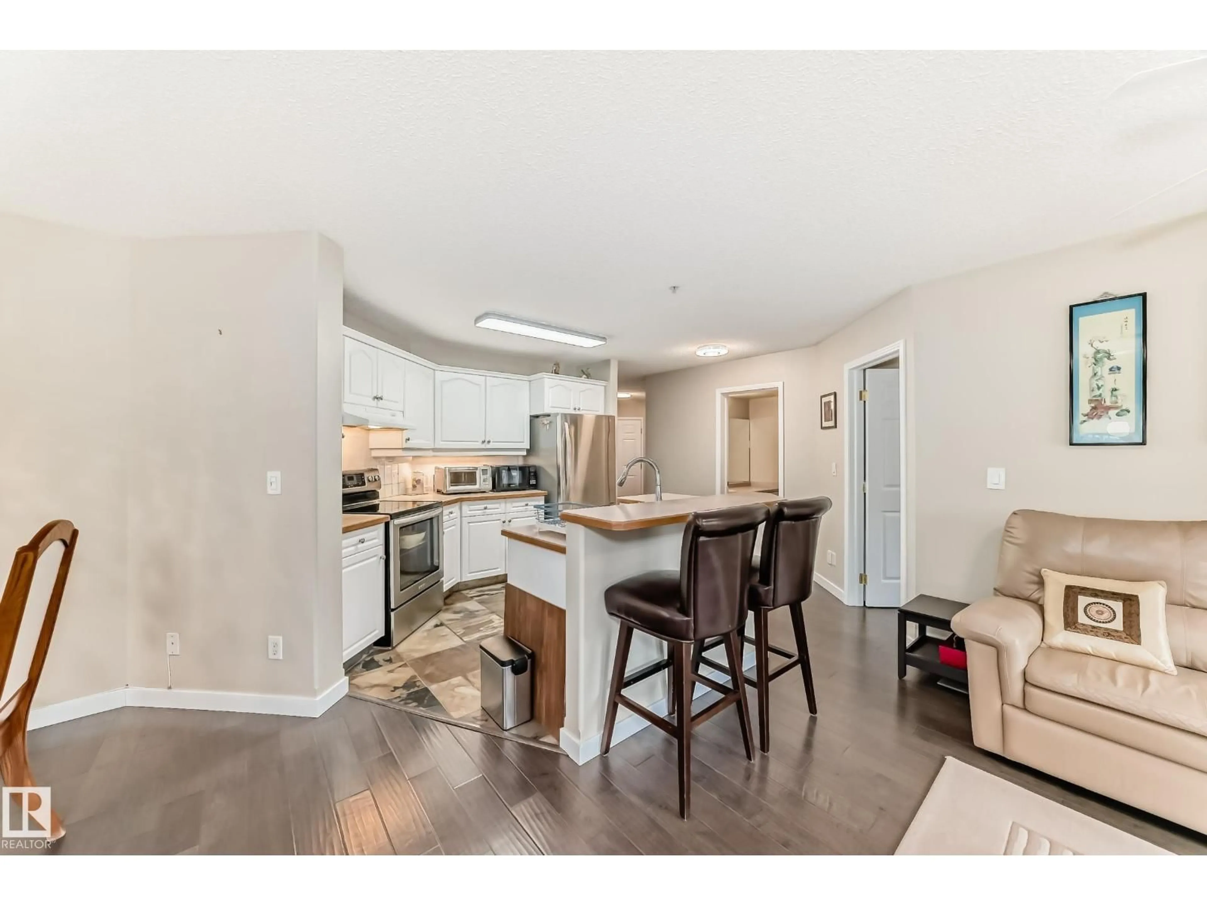 Open concept kitchen, wood/laminate floor for 215 - 10951 124 ST NW, Edmonton Alberta T5Z3H1