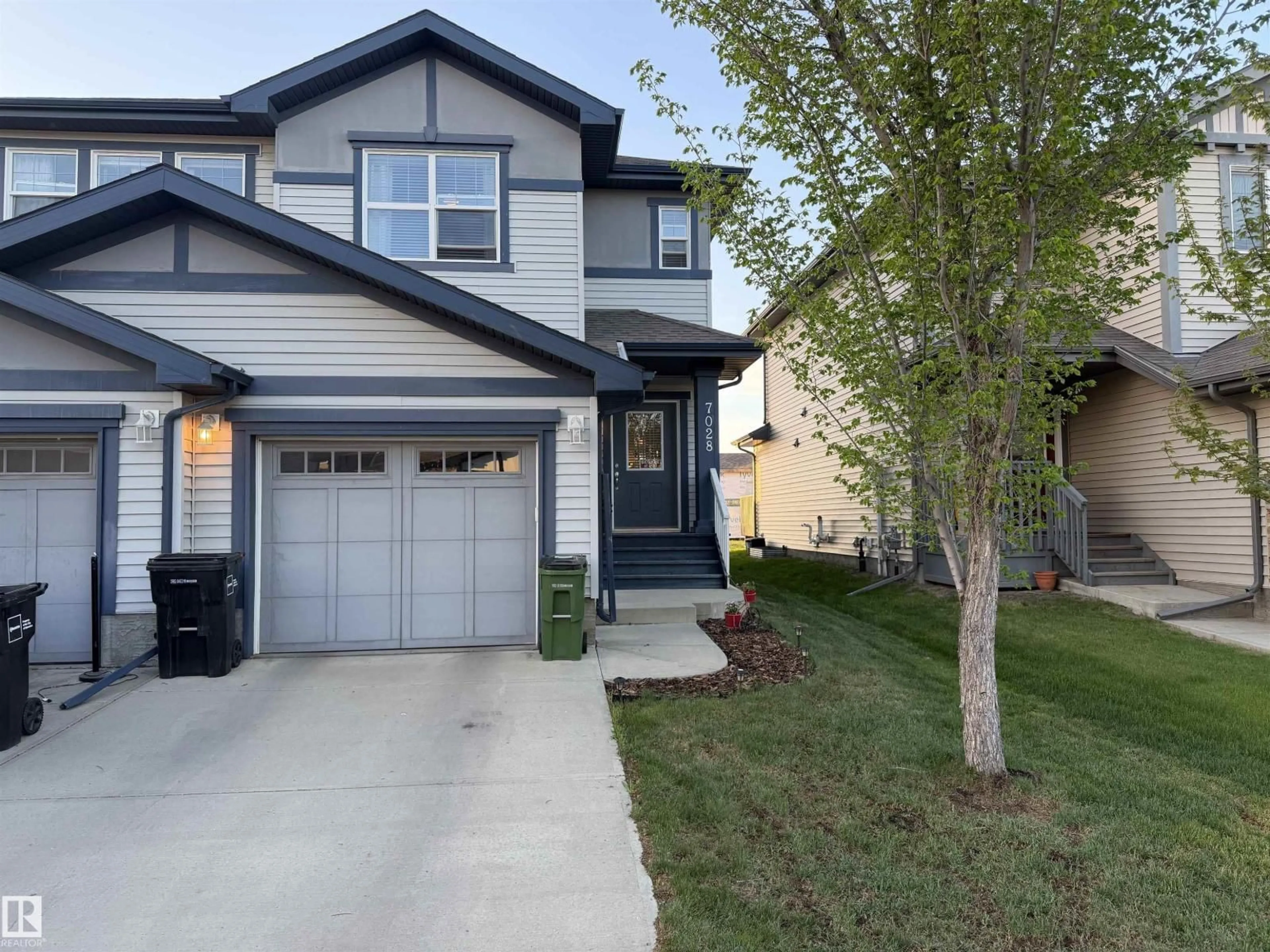 Home with vinyl exterior material, street for 7028 174 AV, Edmonton Alberta T5Z0L3