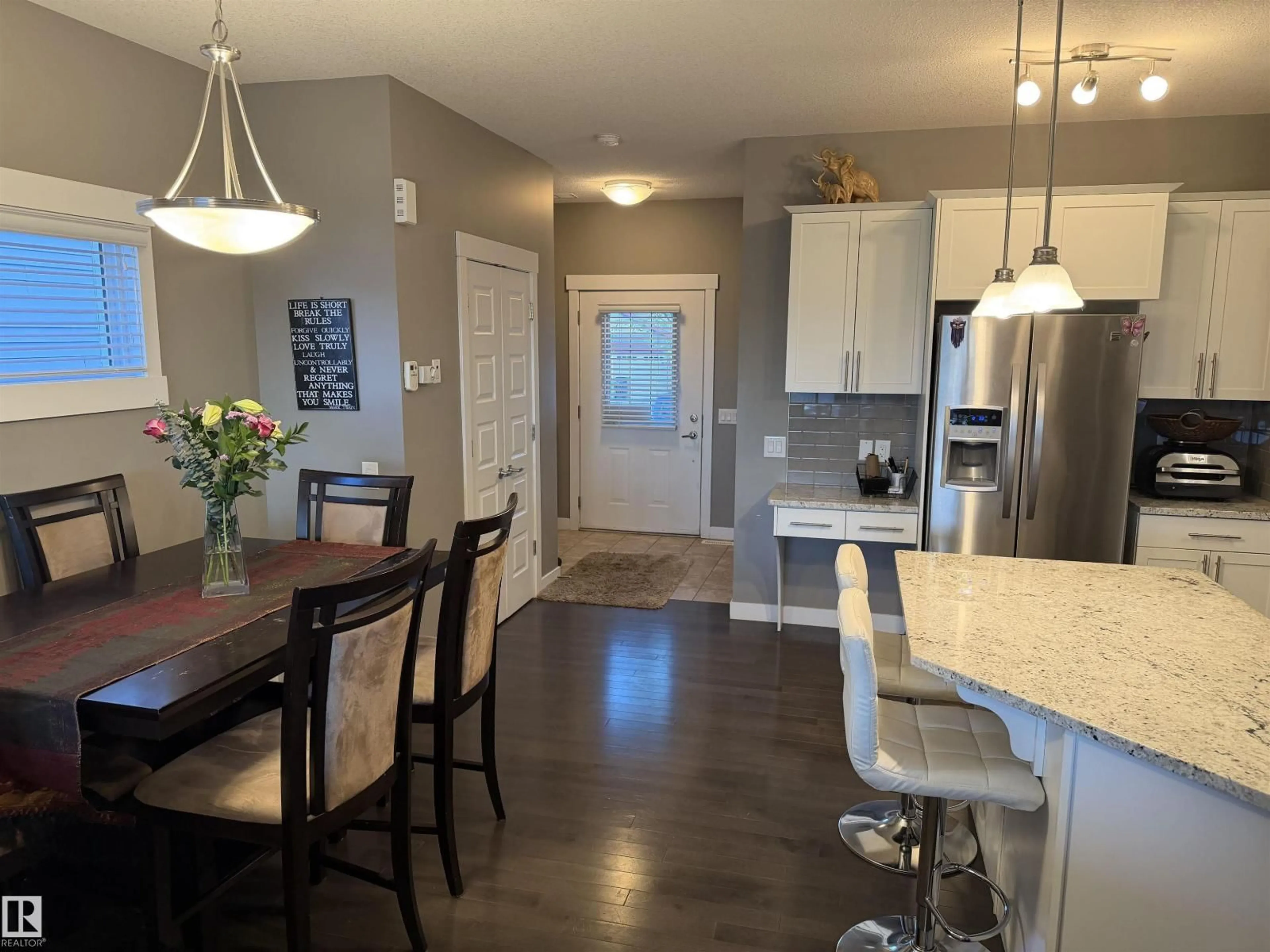 Open concept kitchen, wood/laminate floor for 7028 174 AV, Edmonton Alberta T5Z0L3