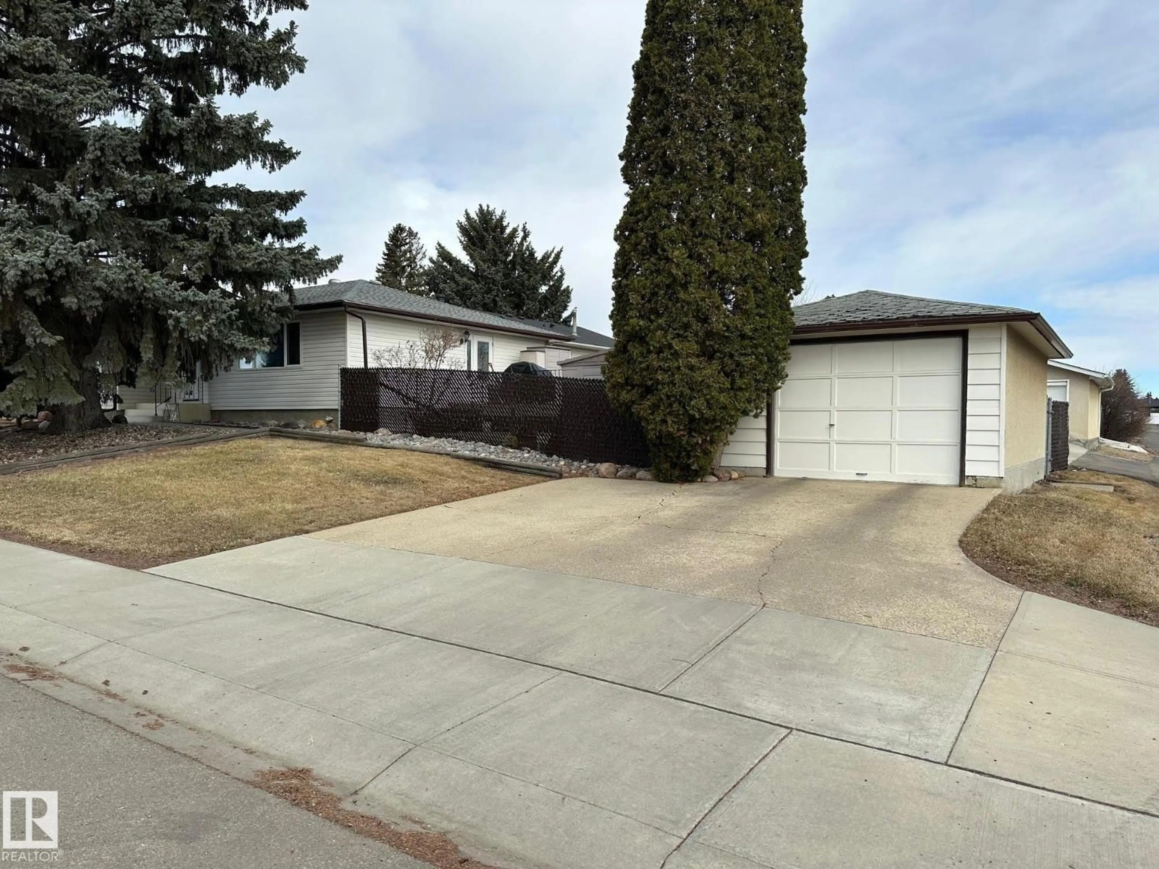 Home with vinyl exterior material, street for 7916 150 AV, Edmonton Alberta T5C2Y4
