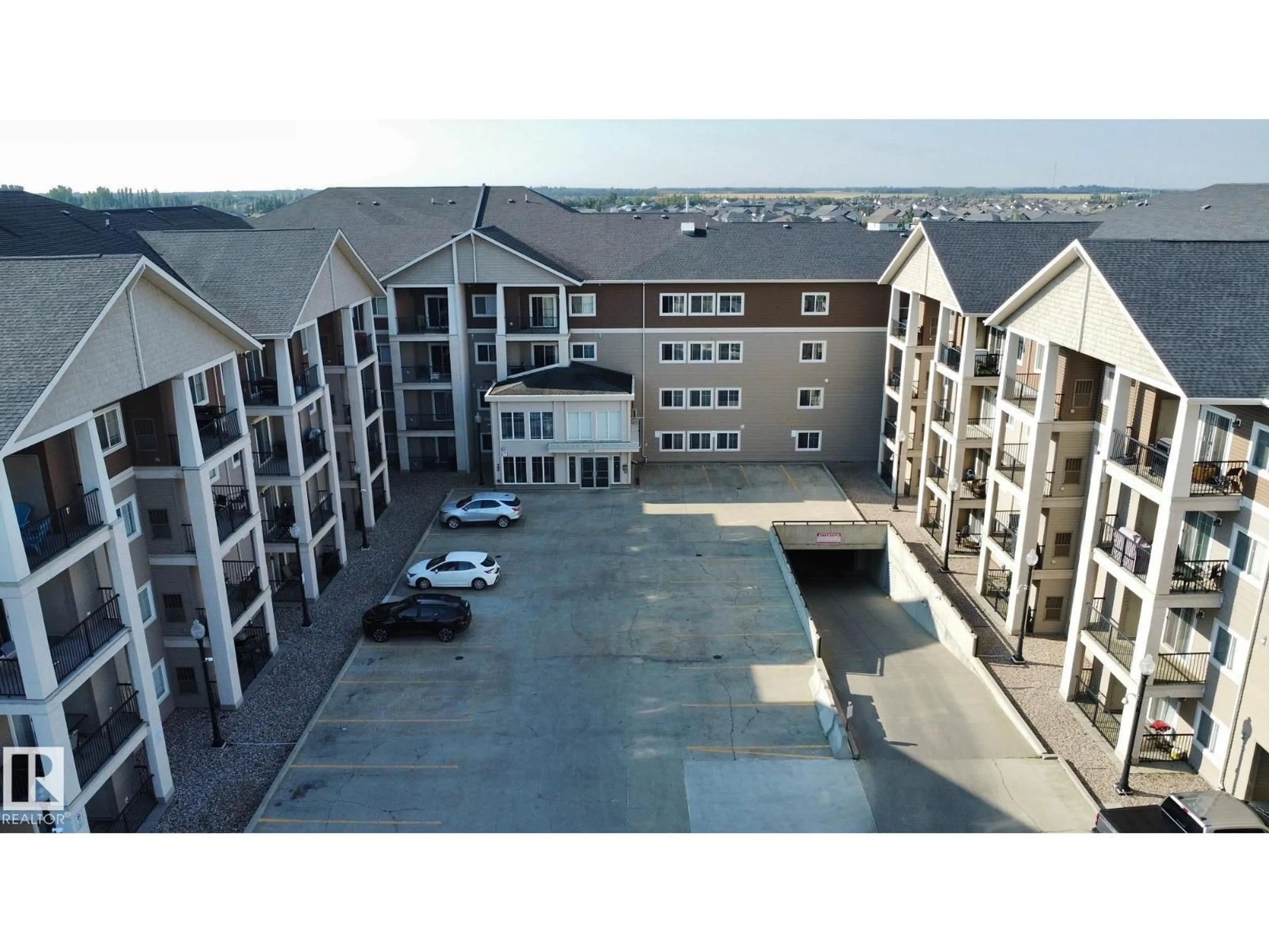 A pic from outside/outdoor area/front of a property/back of a property/a pic from drone, building for #208 - 105 WEST HAVEN DR, Leduc Alberta T9E0R9