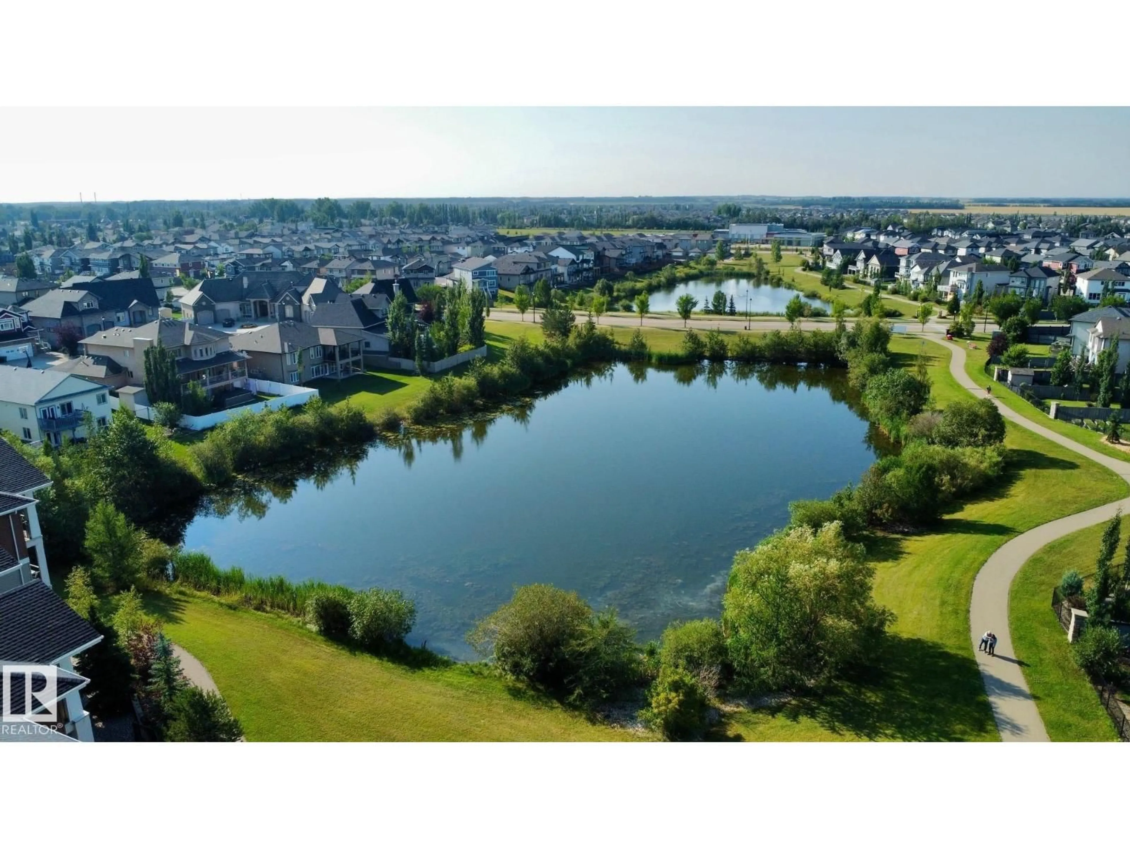 A pic from outside/outdoor area/front of a property/back of a property/a pic from drone, water/lake/river/ocean view for #208 - 105 WEST HAVEN DR, Leduc Alberta T9E0R9