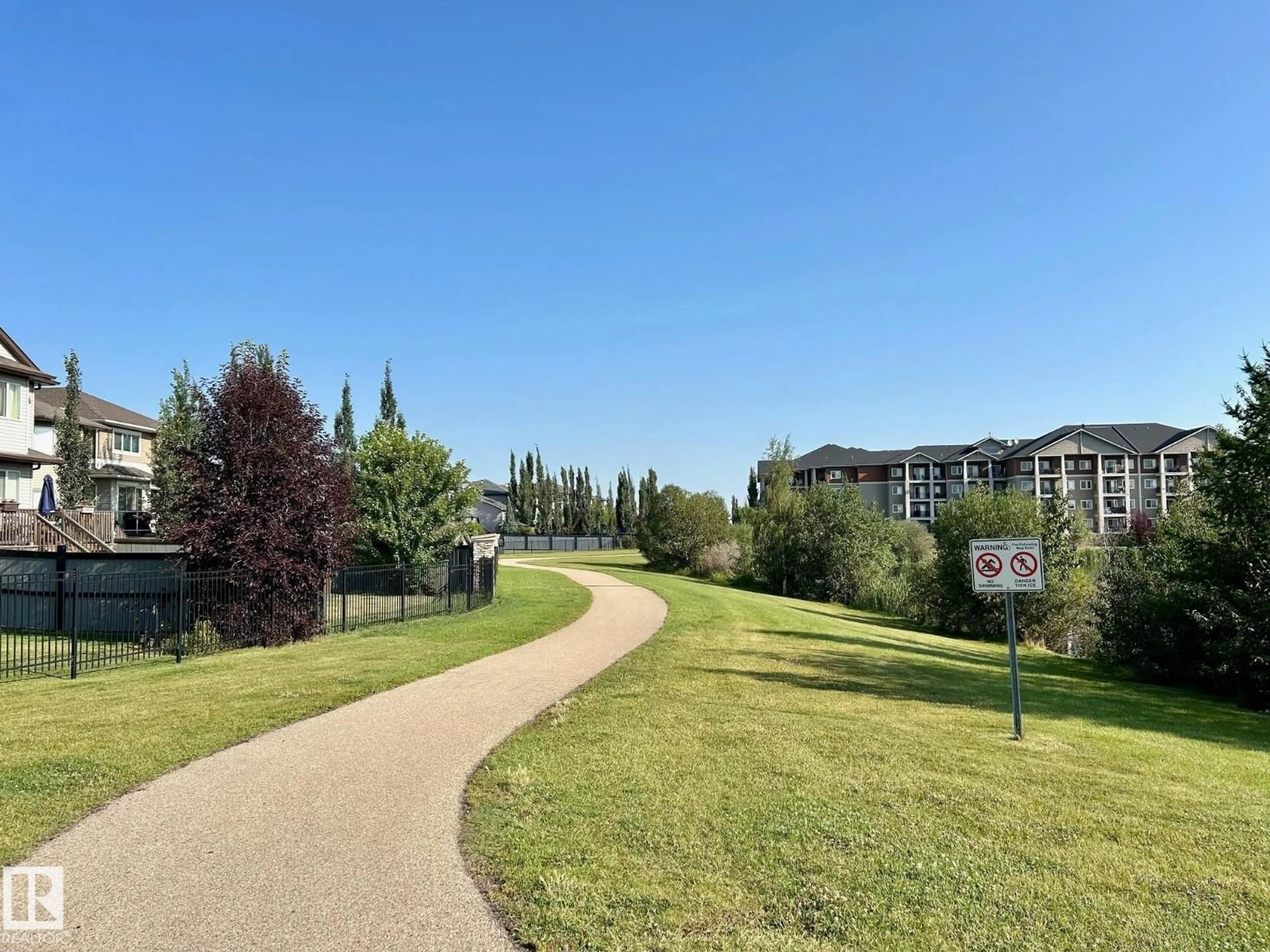 A pic from outside/outdoor area/front of a property/back of a property/a pic from drone, water/lake/river/ocean view for #208 - 105 WEST HAVEN DR, Leduc Alberta T9E0R9