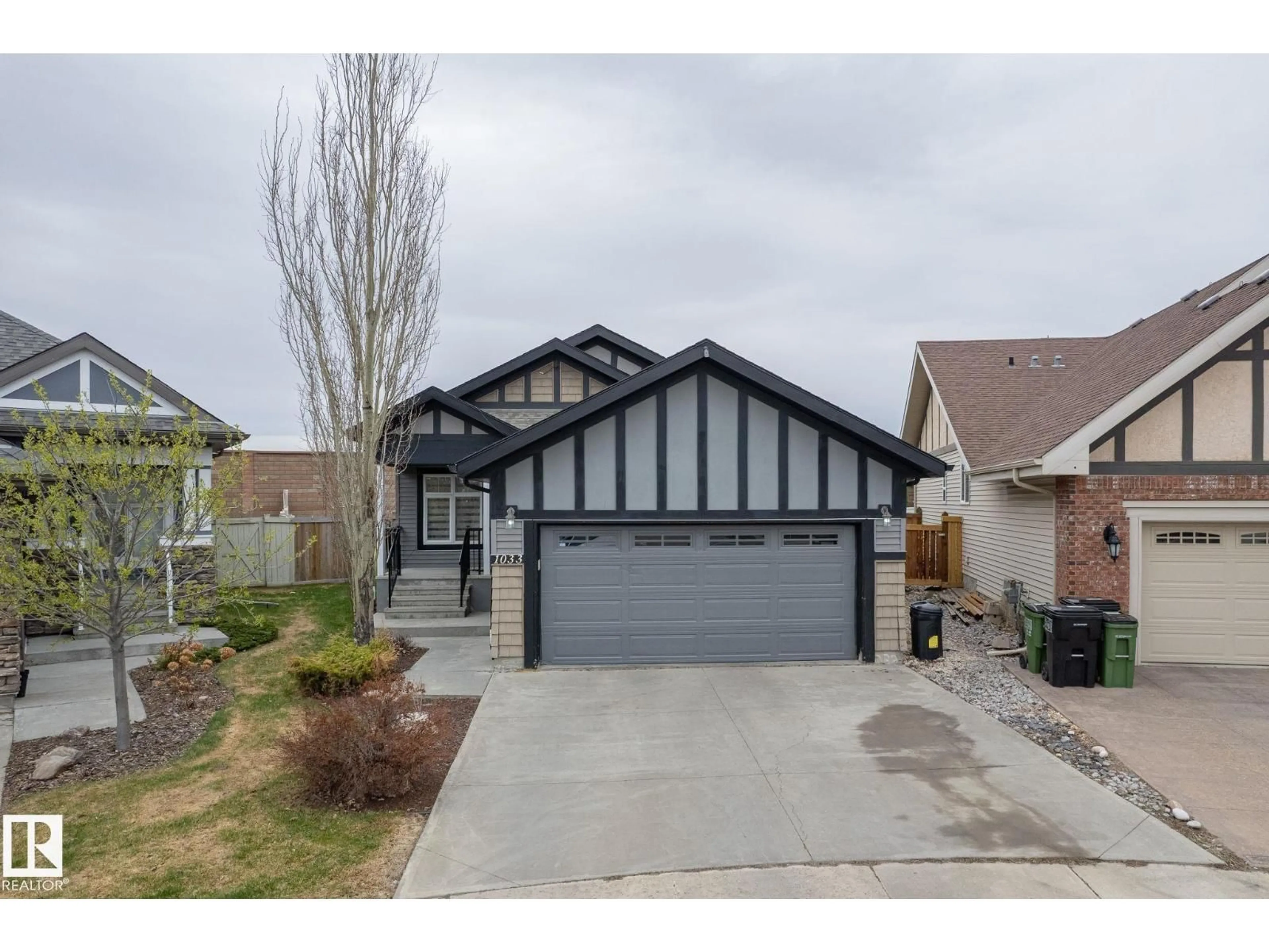 Home with vinyl exterior material, street for 1033 CHAHLEY LN, Edmonton Alberta T6M0K5