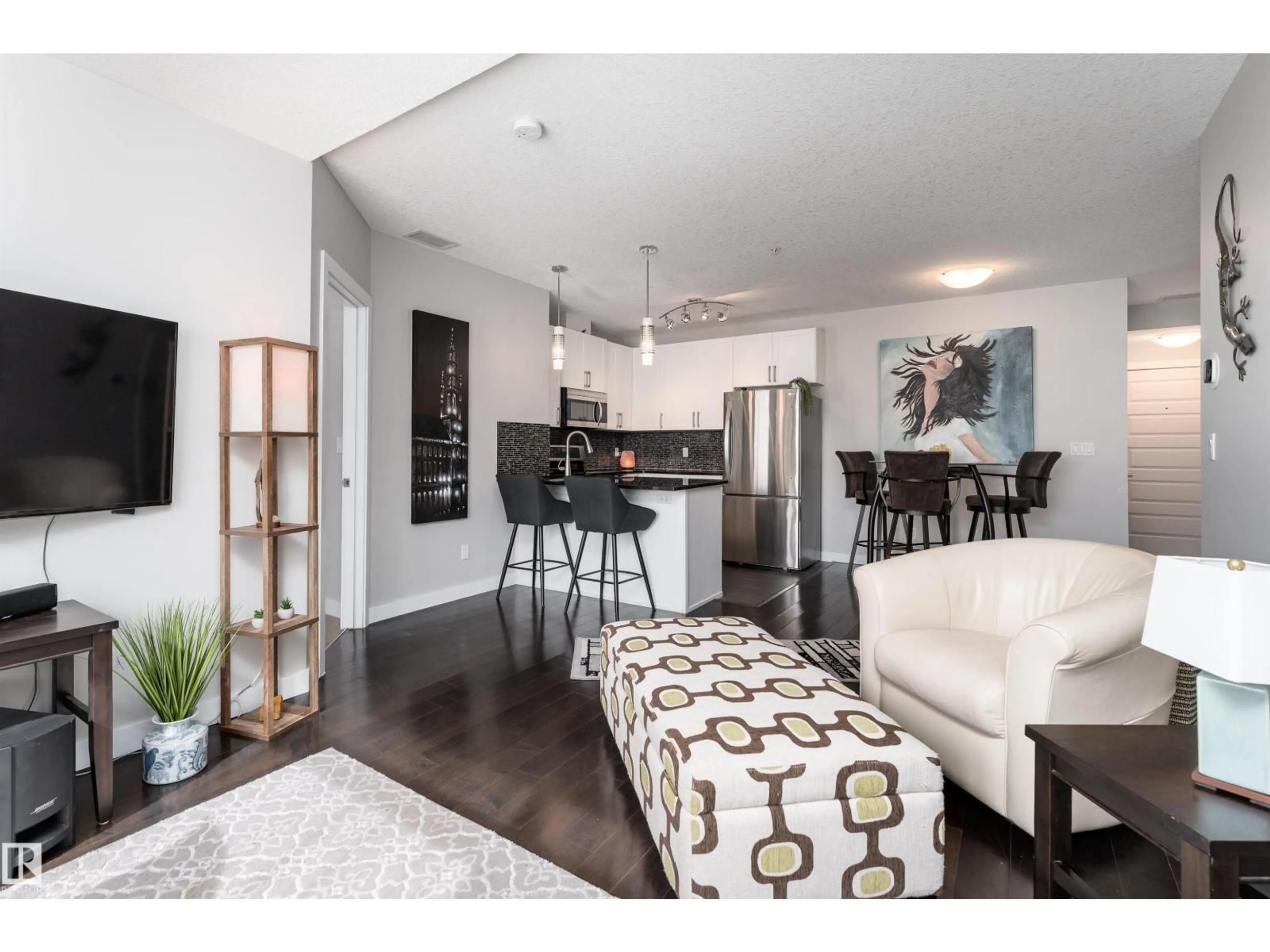 Open concept kitchen, wood/laminate floor for 224 5151 WINDERMERE BV, Edmonton Alberta T6W2K4