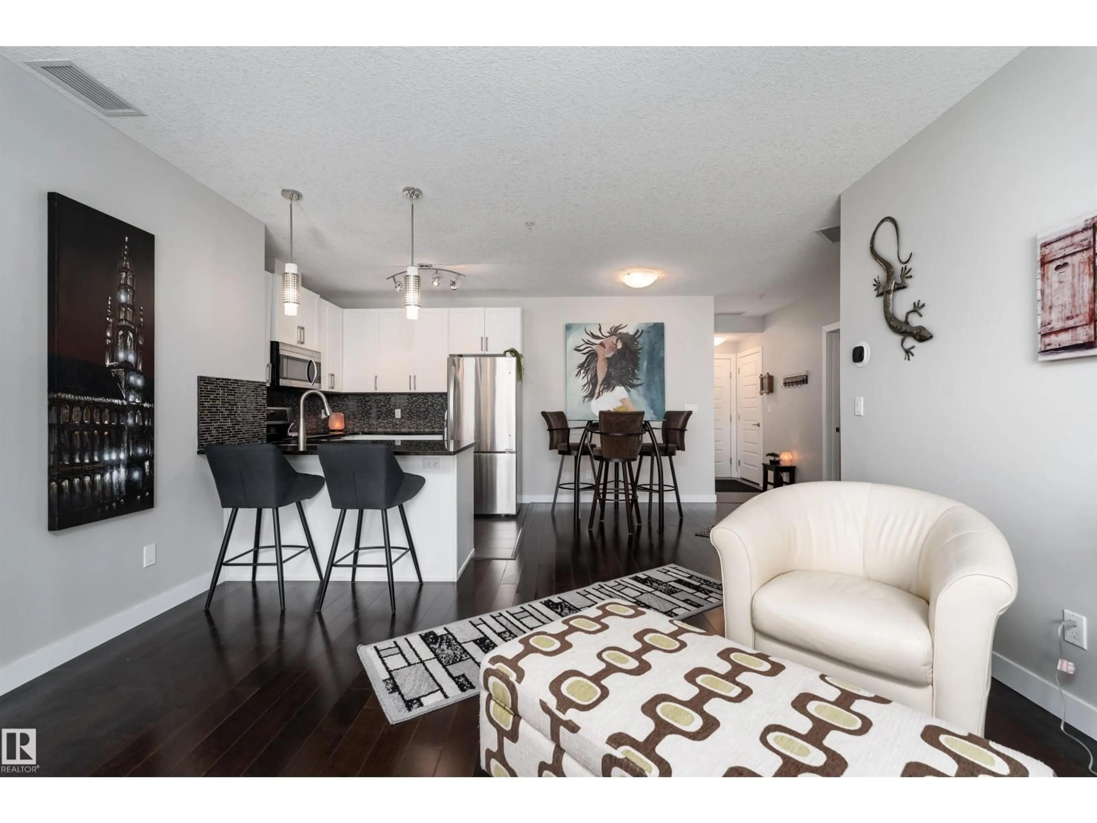Open concept kitchen, wood/laminate floor for 224 5151 WINDERMERE BV, Edmonton Alberta T6W2K4