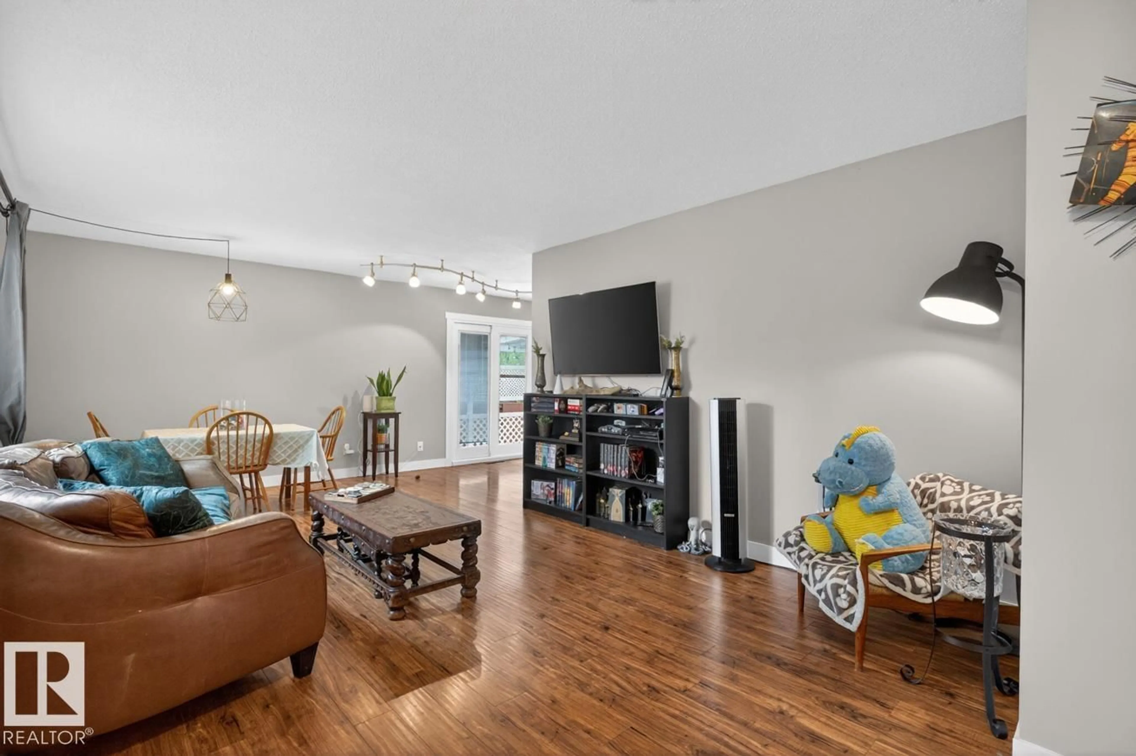 Living room with furniture, wood/laminate floor for NW - 13319 118 ST, Edmonton Alberta T5E5L6