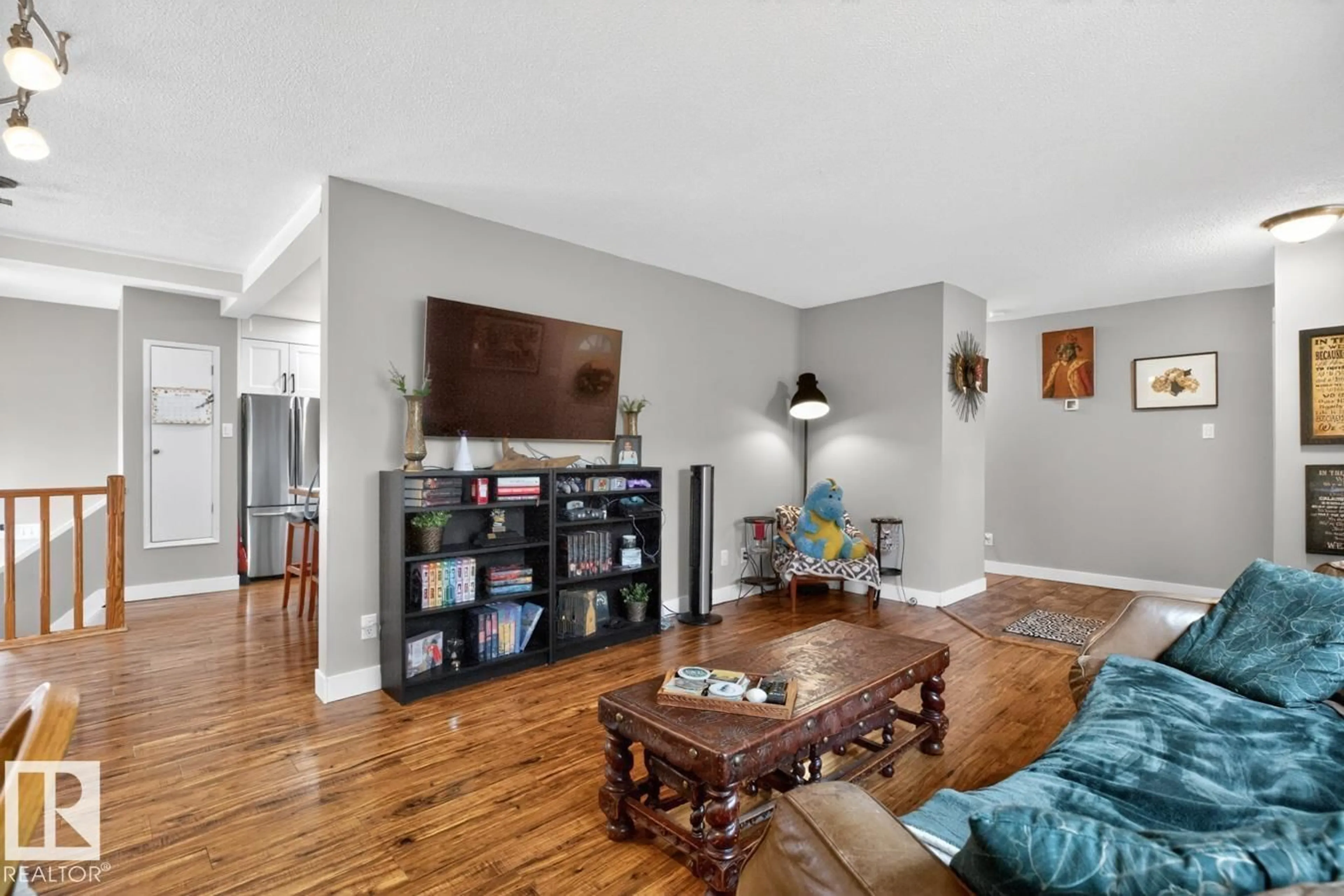 Living room with furniture, wood/laminate floor for NW - 13319 118 ST, Edmonton Alberta T5E5L6