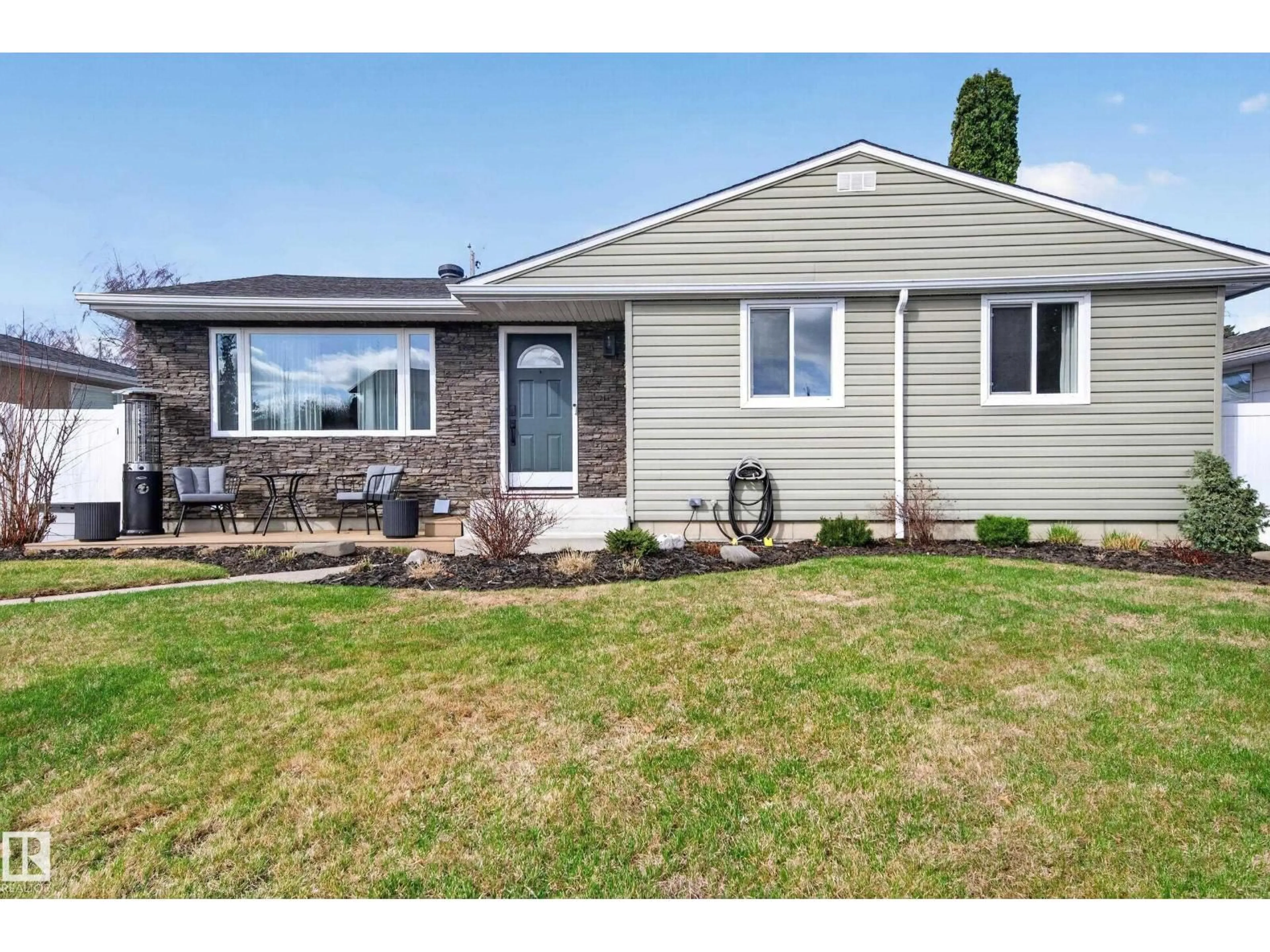 Home with vinyl exterior material, street for 10740 44 ST, Edmonton Alberta T6A1W4