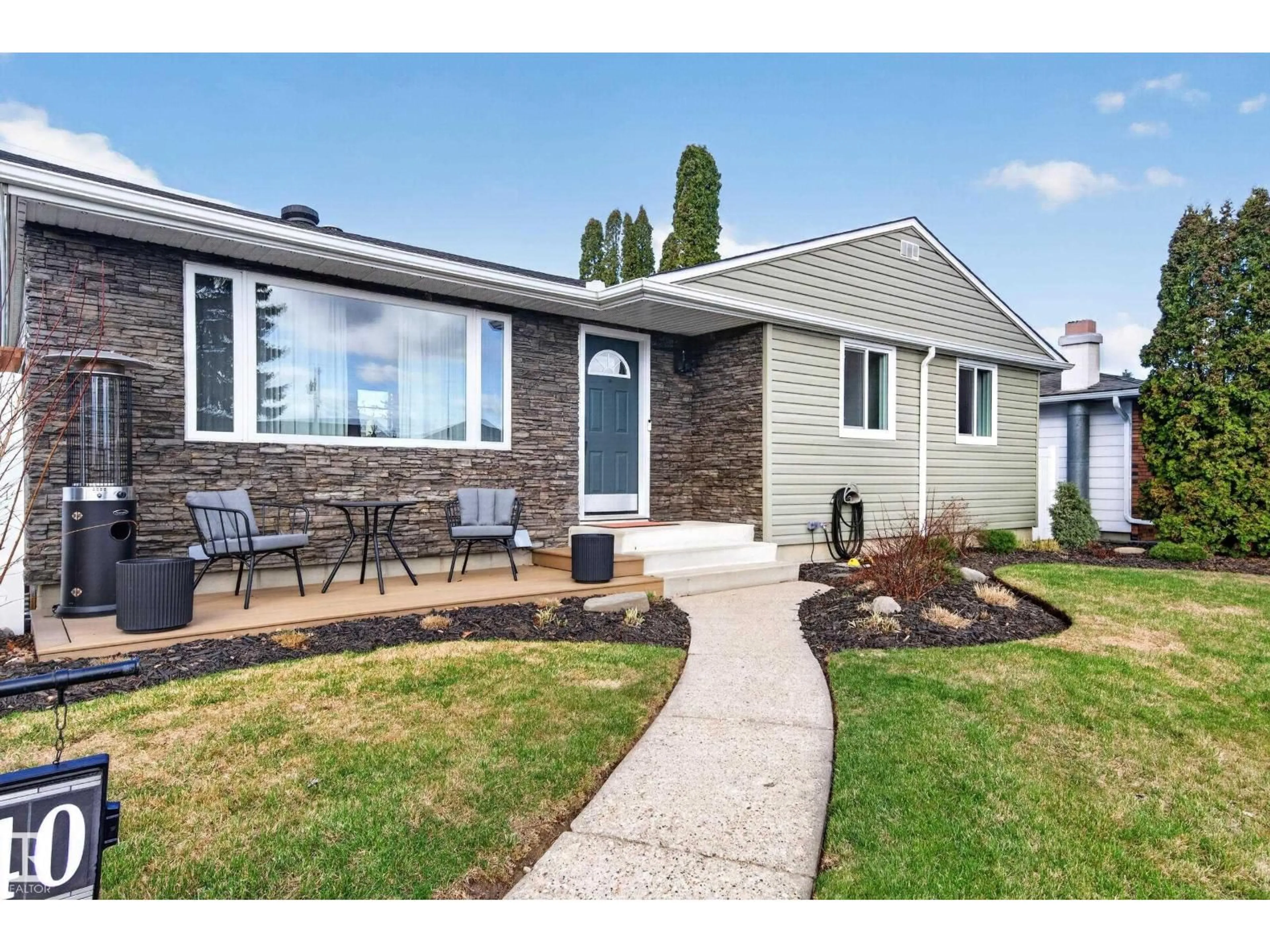 Home with vinyl exterior material, street for 10740 44 ST, Edmonton Alberta T6A1W4