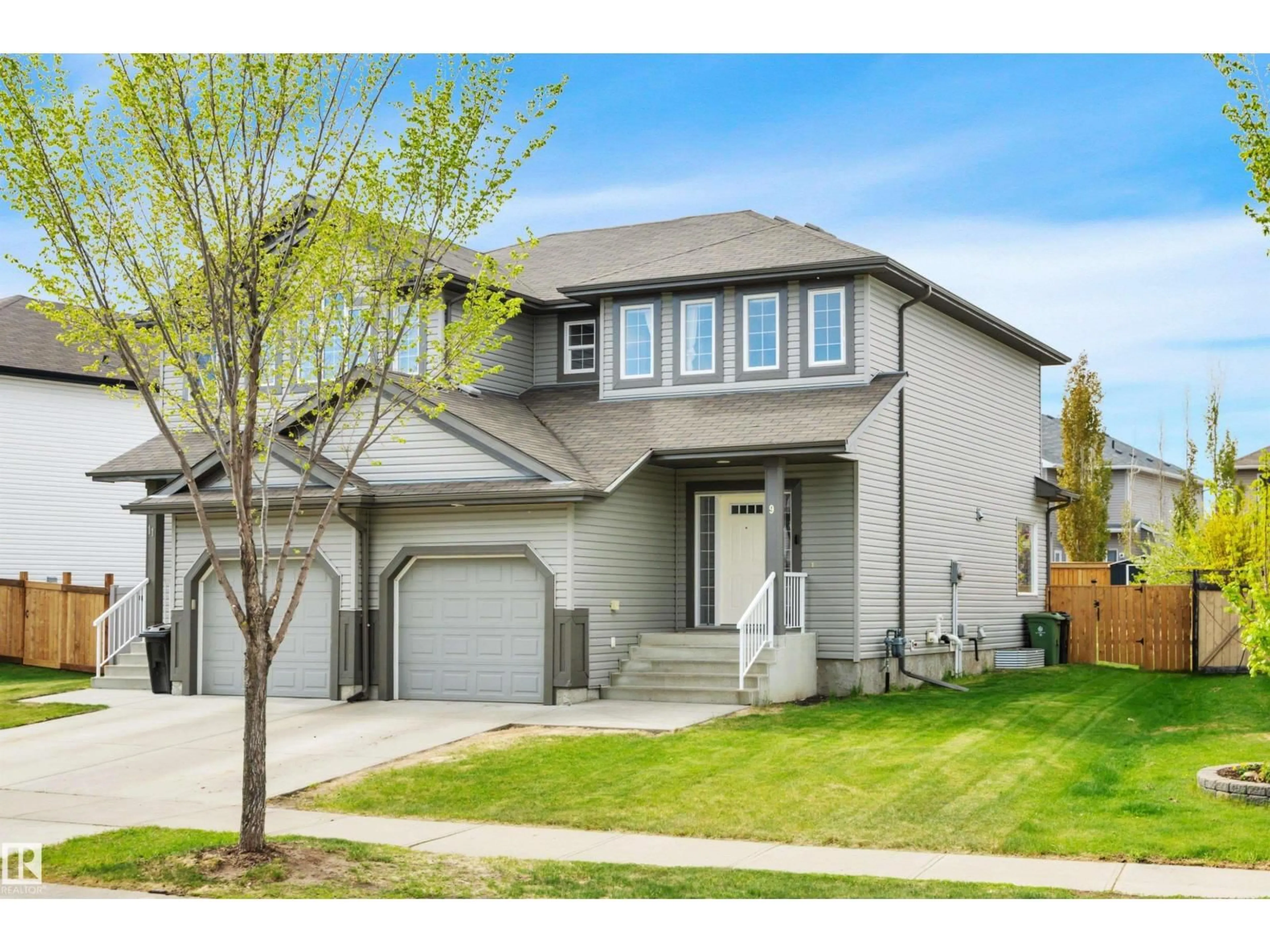 Home with vinyl exterior material, street for 9 CARAGANA WY, Fort Saskatchewan Alberta T8L0H8