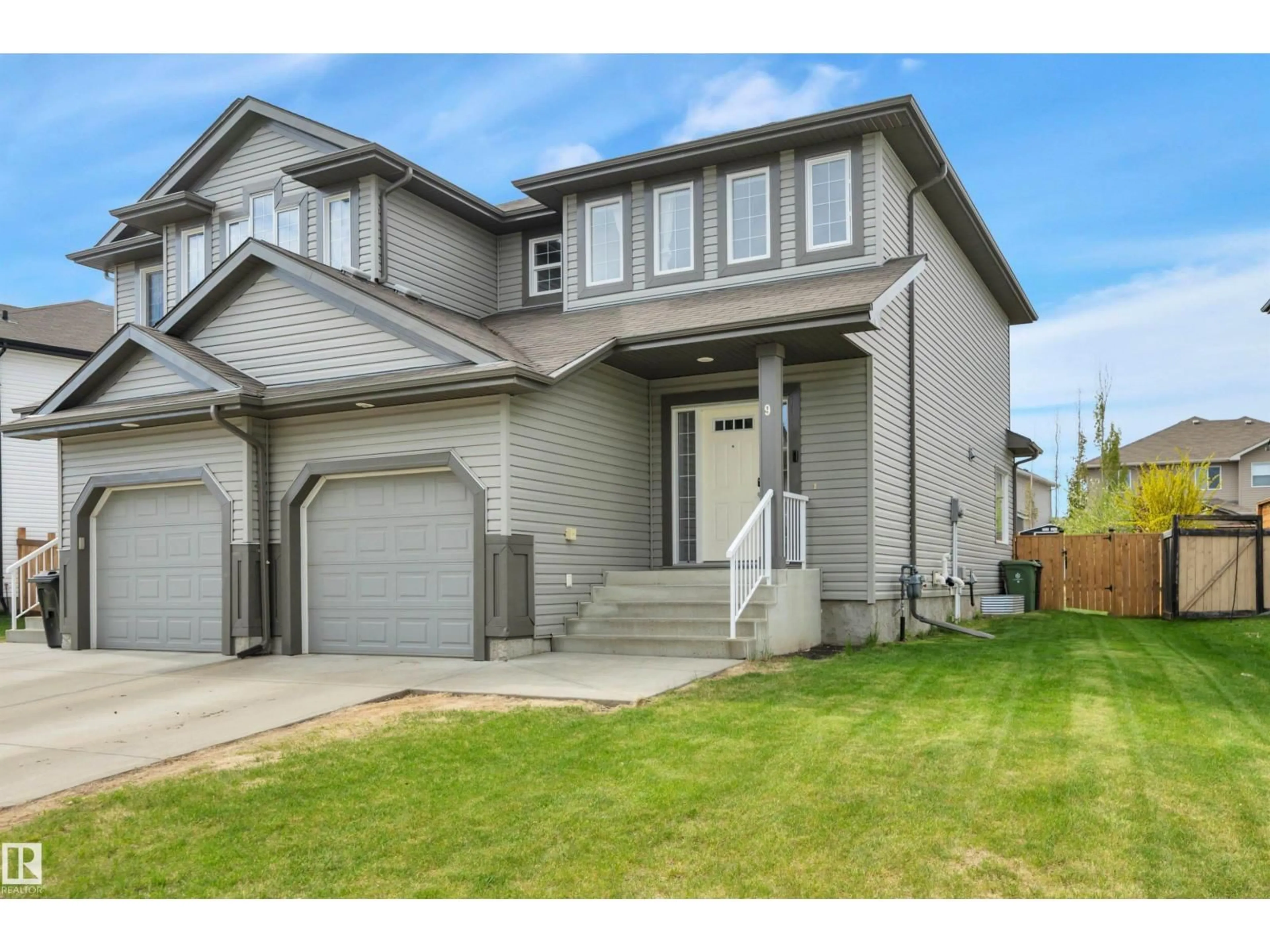Home with vinyl exterior material, street for 9 CARAGANA WY, Fort Saskatchewan Alberta T8L0H8