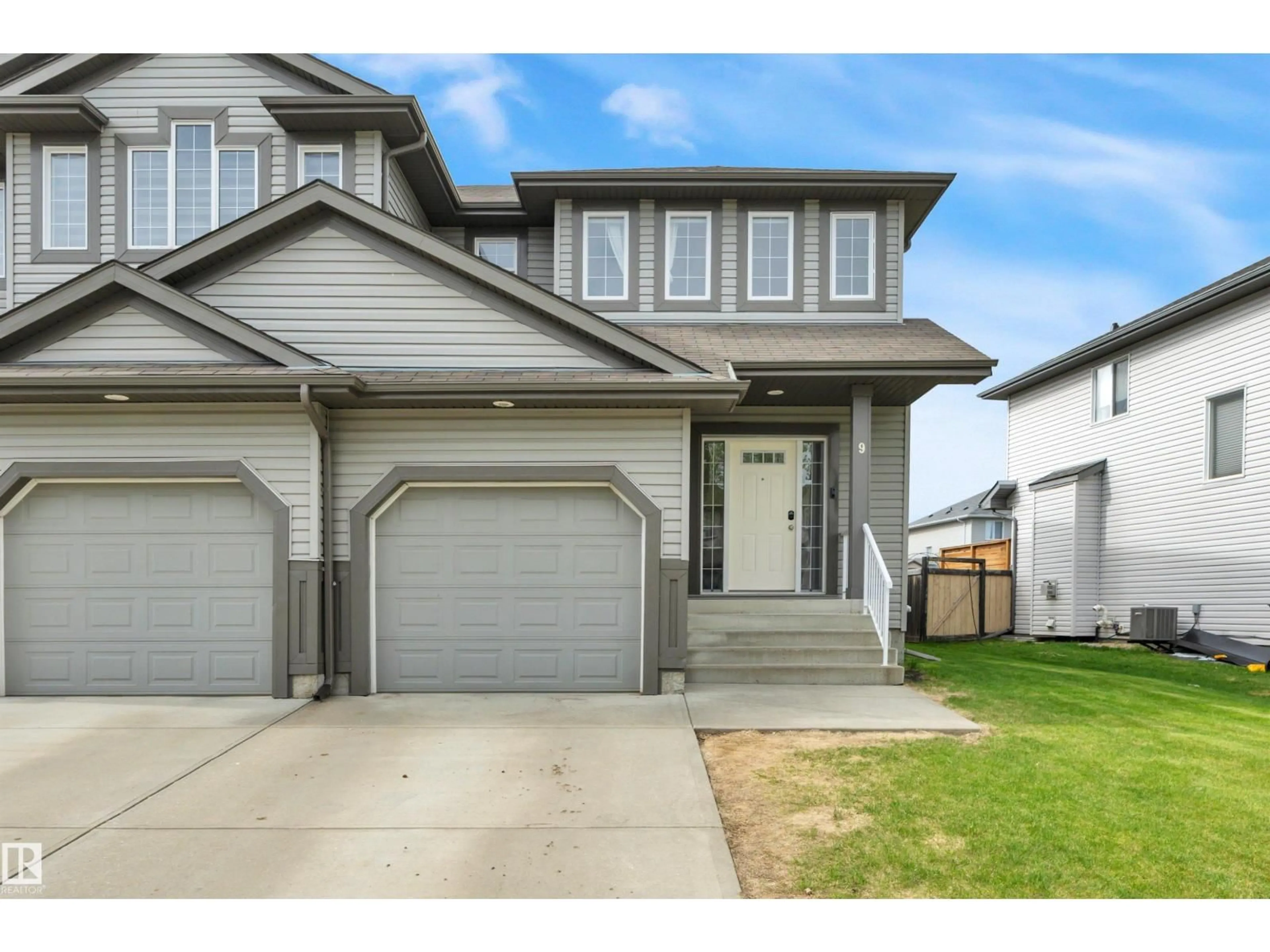 Home with vinyl exterior material, street for 9 CARAGANA WY, Fort Saskatchewan Alberta T8L0H8