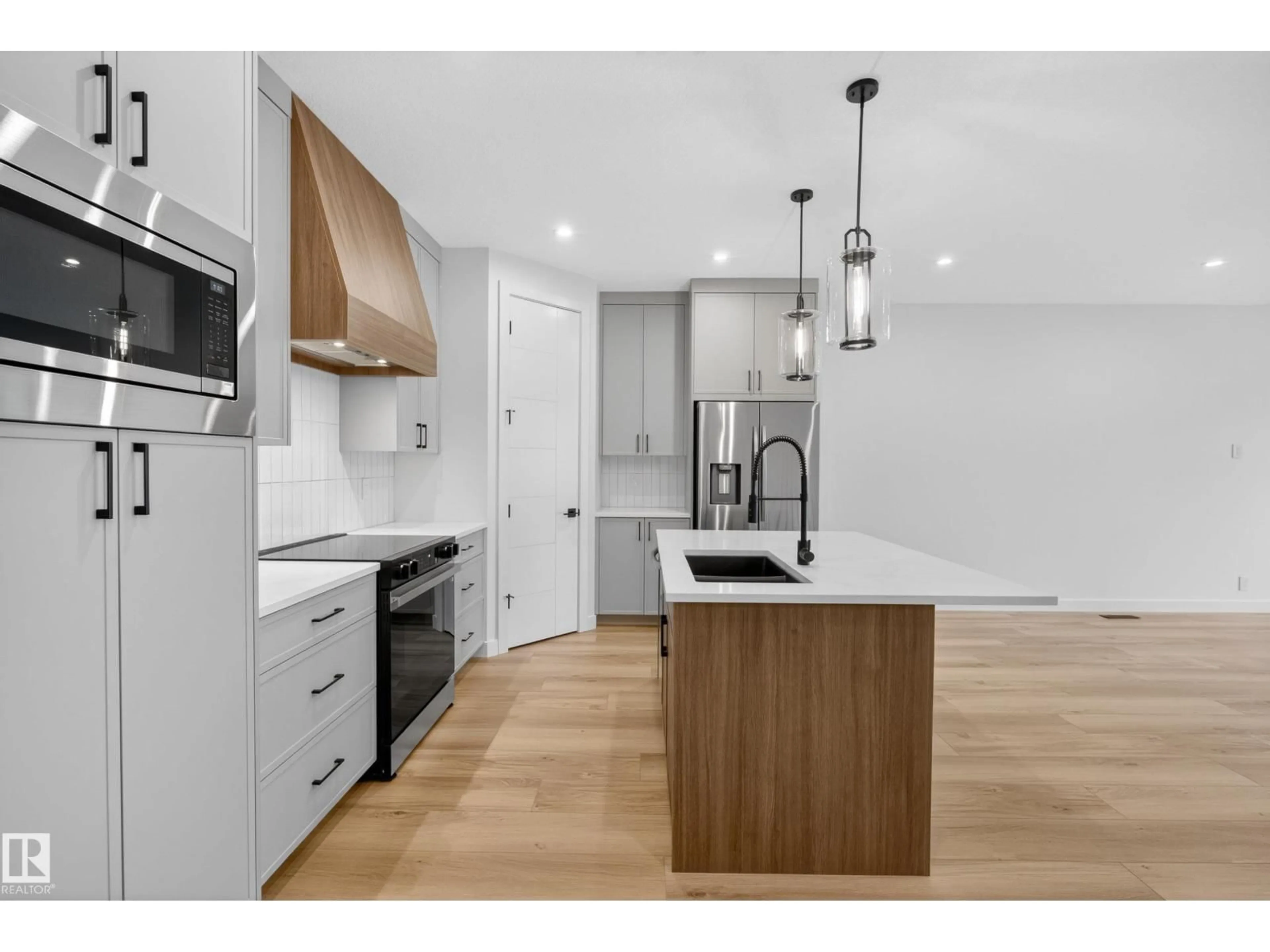 Open concept kitchen, wood/laminate floor for 99 NEWBURY CI, Sherwood Park Alberta T8B0E8