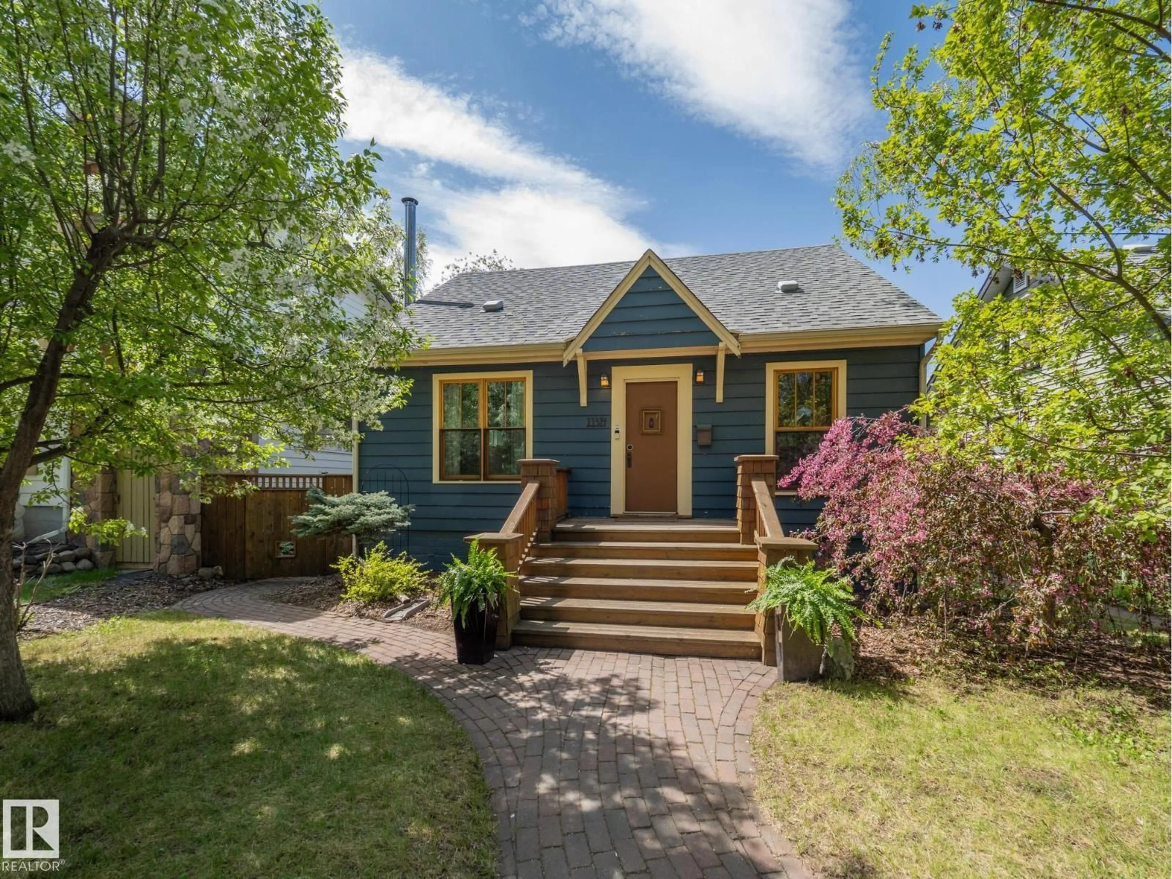 Home with vinyl exterior material, street for NW - 11314 68 ST, Edmonton Alberta T5B1N7