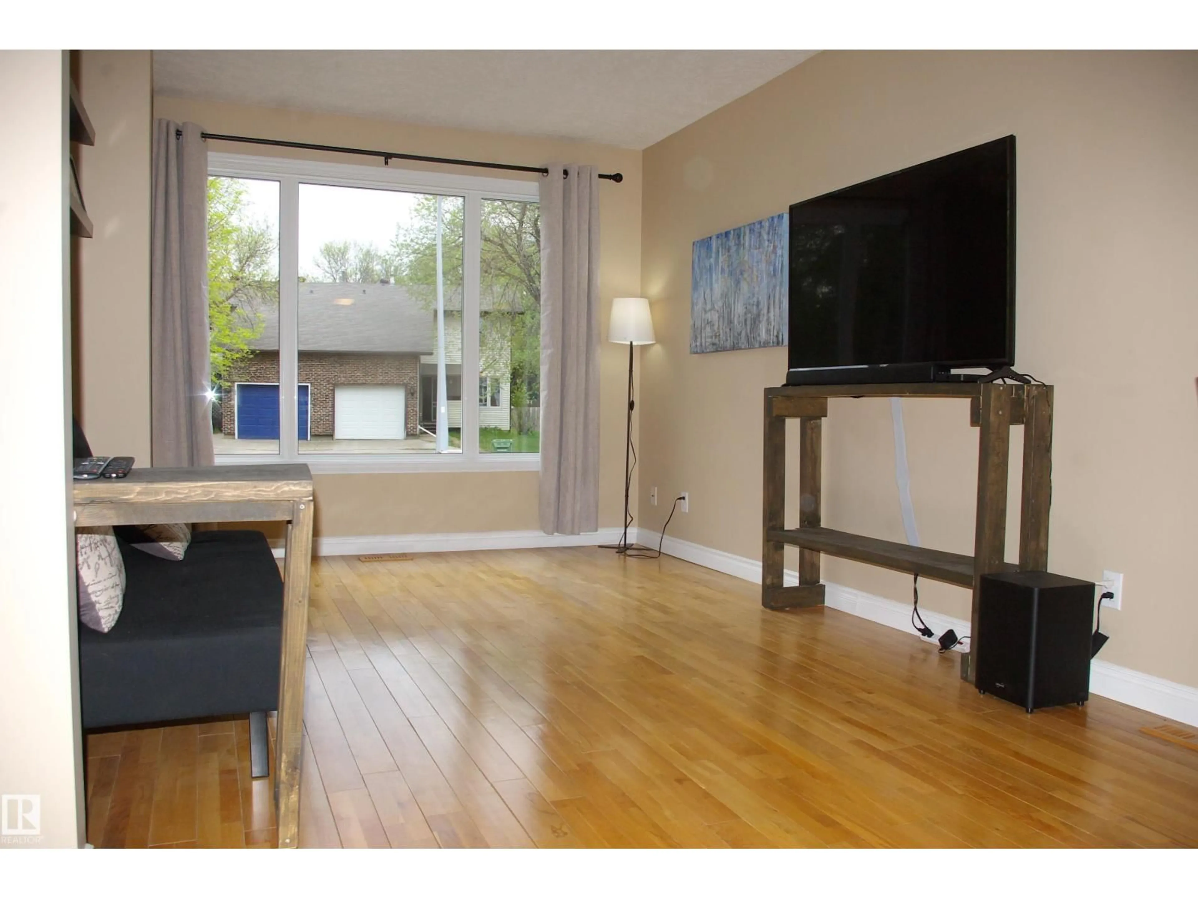 Living room with furniture, wood/laminate floor for 45 WALDEN CR, St. Albert Alberta T8N3N5