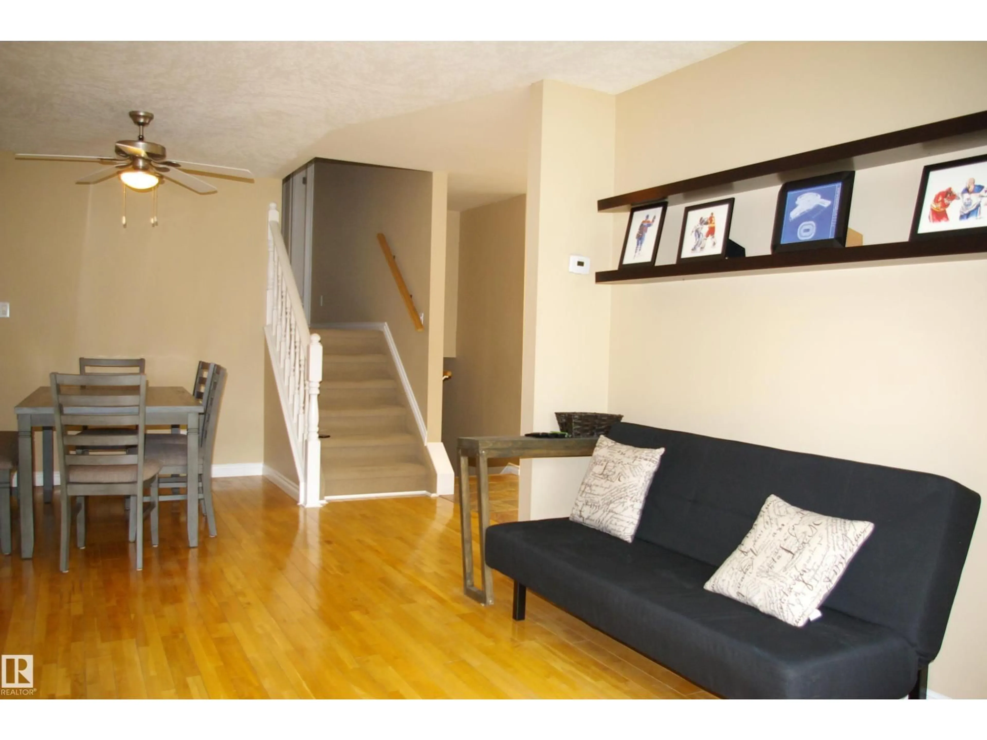Living room with furniture, wood/laminate floor for 45 WALDEN CR, St. Albert Alberta T8N3N5
