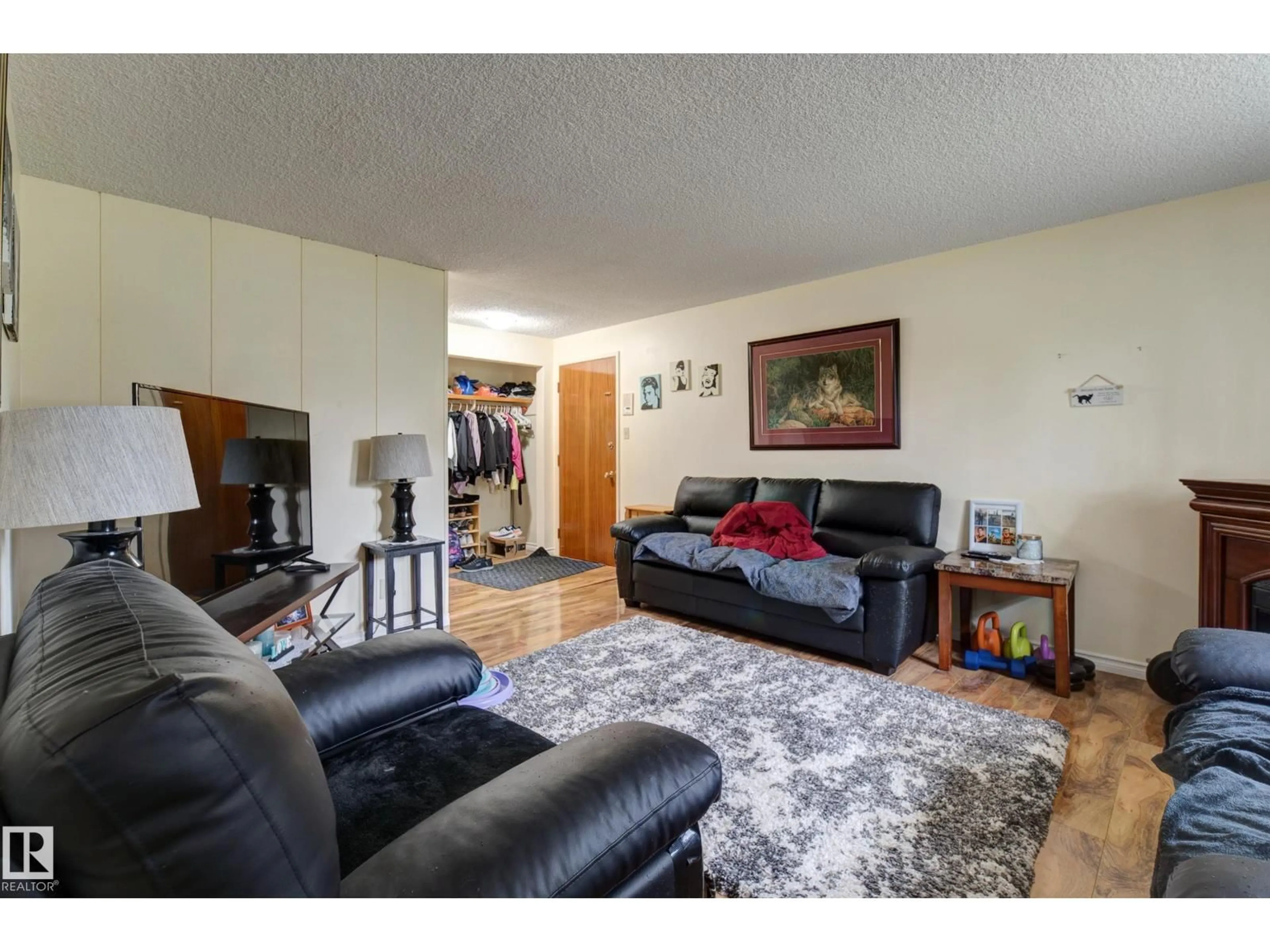 Living room with furniture, wood/laminate floor for NW - 9749 88 AV, Edmonton Alberta T6E2R1