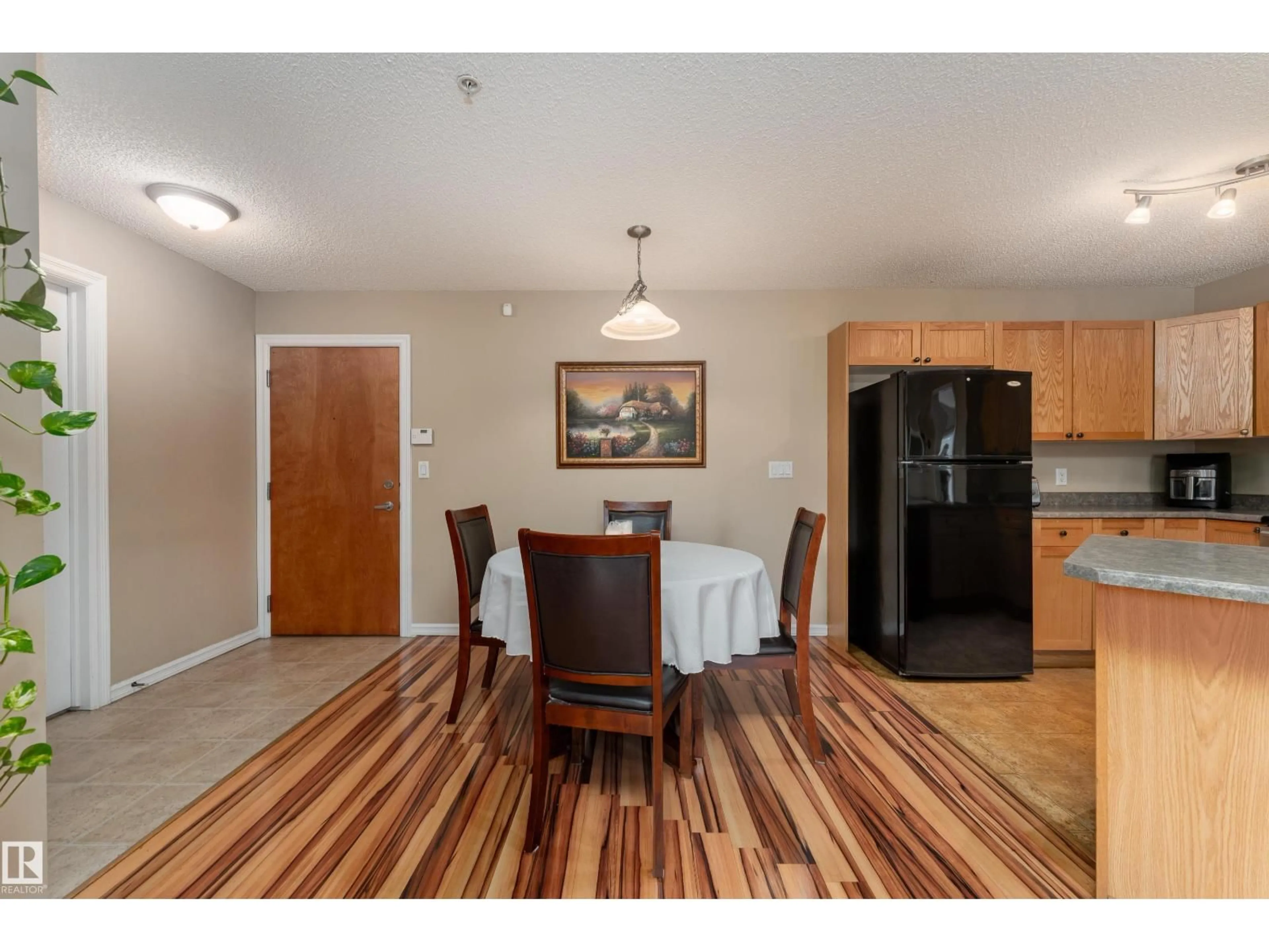 Dining room, wood/laminate floor for #103 - 13710 150 AV, Edmonton Alberta T6V0B2